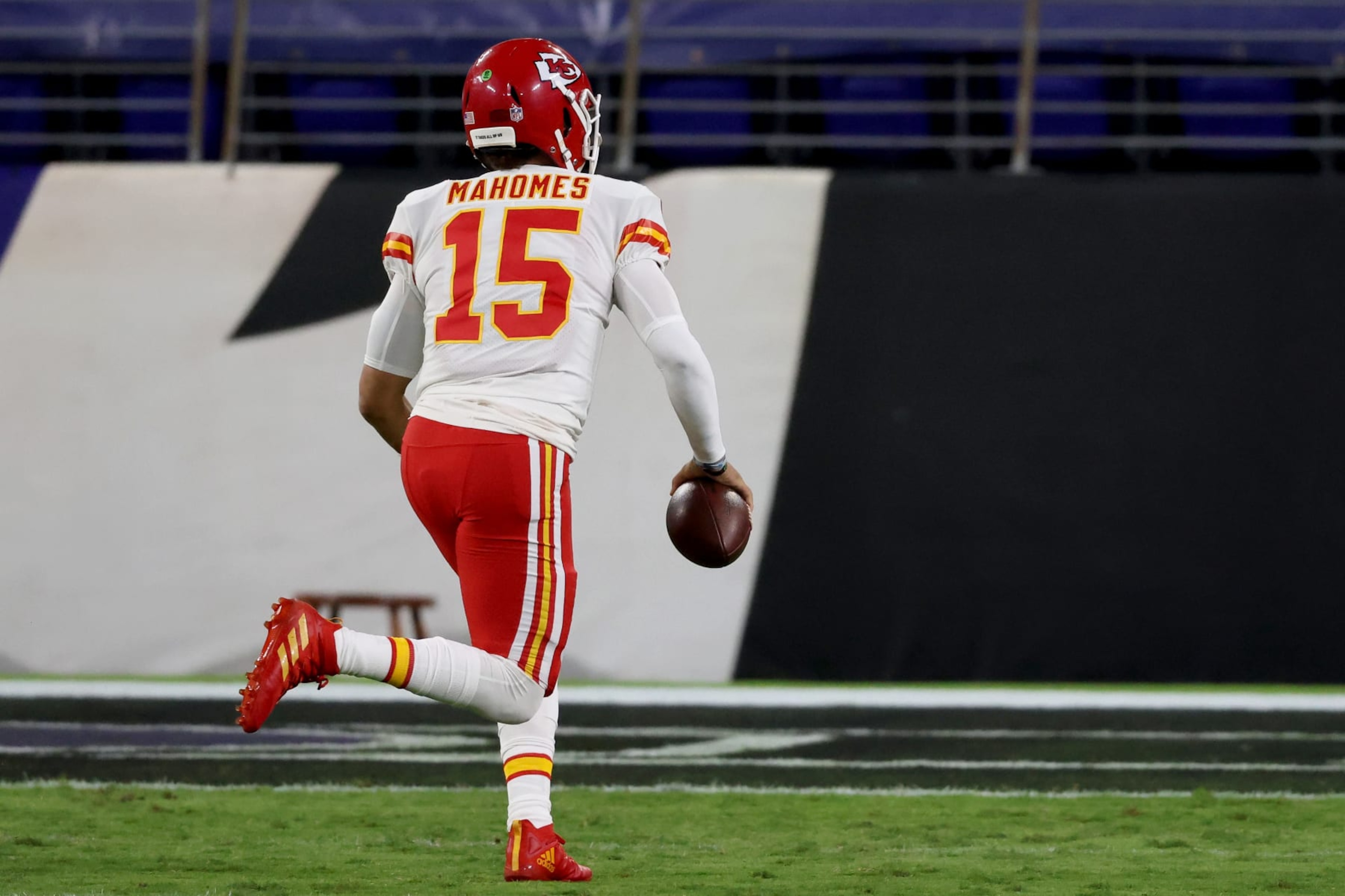 BALTIMORE, MARYLAND - SEPTEMBER 28: Quarterback Patrick Mahomes #15 of the Kansas City Chiefs rushes for a touchdown against the Baltimore Ravens in the first half  at M&T Bank Stadium on September 28, 2020 in Baltimore, Maryland. (Photo by Rob Carr/Getty Images)