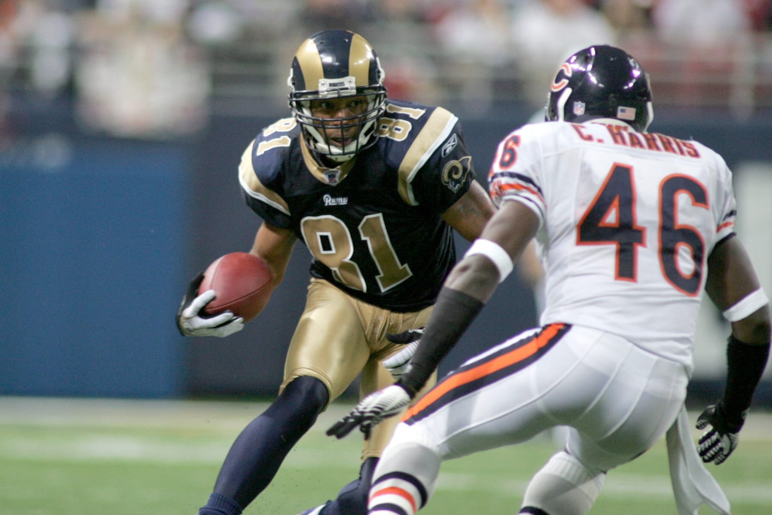 ST. LOUIS, MO - DECEMBER 11: Torry Holt #81 of the St. Louis Rams runs with the ball during a game against the Chicago Bears on December 11, 2006 at the Edward Jones Dome Stadium in St. Louis, Missouri. (Photo by Sporting News via Getty Images via Getty Images) 
