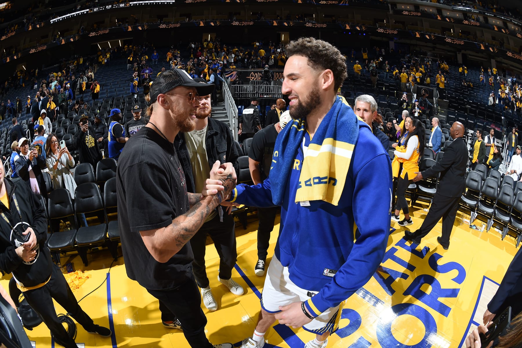 SAN FRANCISCO, CA - MAY 4: Klay Thompson #11 of the Golden State Warriors high fives George Kittle after the game against the Los Angeles Lakers during the Western Conference Semi Finals of the 2023 NBA Playoffs on May 4, 2023 at Chase Center in San Francisco, California. NOTE TO USER: User expressly acknowledges and agrees that, by downloading and/or using this Photograph, user is consenting to the terms and conditions of the Getty Images License Agreement. Mandatory Copyright Notice: Copyright 2023 NBAE (Photo by Andrew D. Bernstein/NBAE via Getty Images)