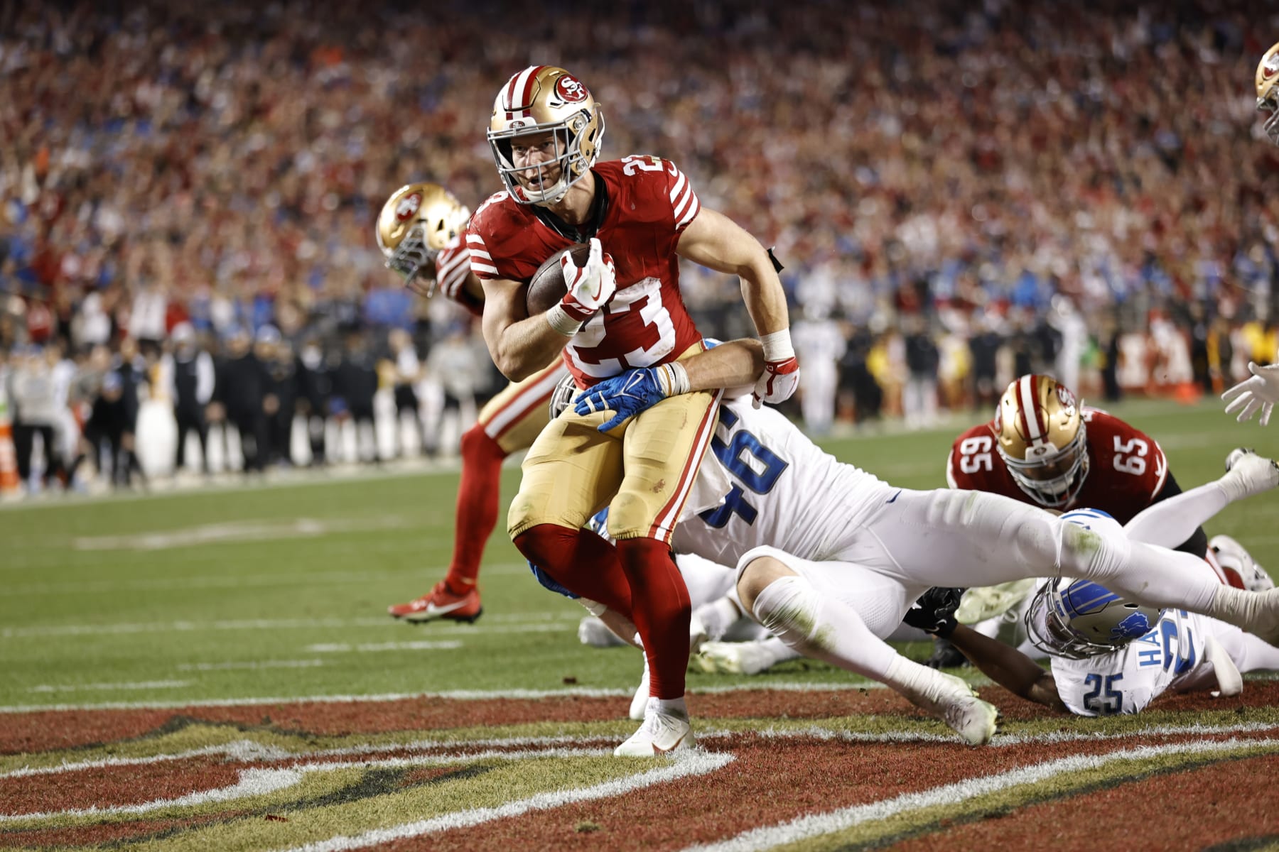 SANTA CLARA, CA - JANUARY 28: Christian McCaffrey #23 of the San Francisco 49ers rushes for a 1-yard touchdown during the NFC Championship game against the Detroit Lions at Levi's Stadium on January 28, 2024 in Santa Clara, California. The 49ers defeated the Lions 34-31. (Photo by Michael Zagaris/San Francisco 49ers/Getty Images)
