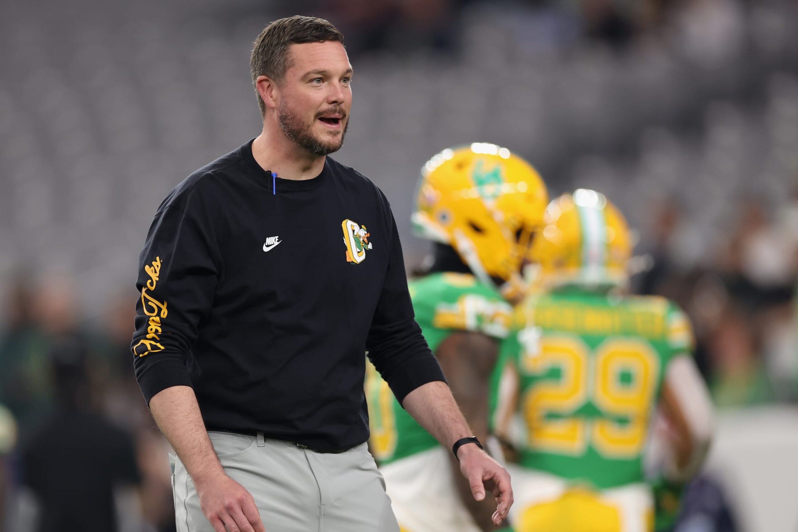 GLENDALE, ARIZONA - JANUARY 01: Head coach Dan Lanning of the Oregon Ducks watches warm ups to the Fiesta Bowl against the Liberty Flames at State Farm Stadium on January 01, 2024 in Glendale, Arizona. (Photo by Christian Petersen/Getty Images)