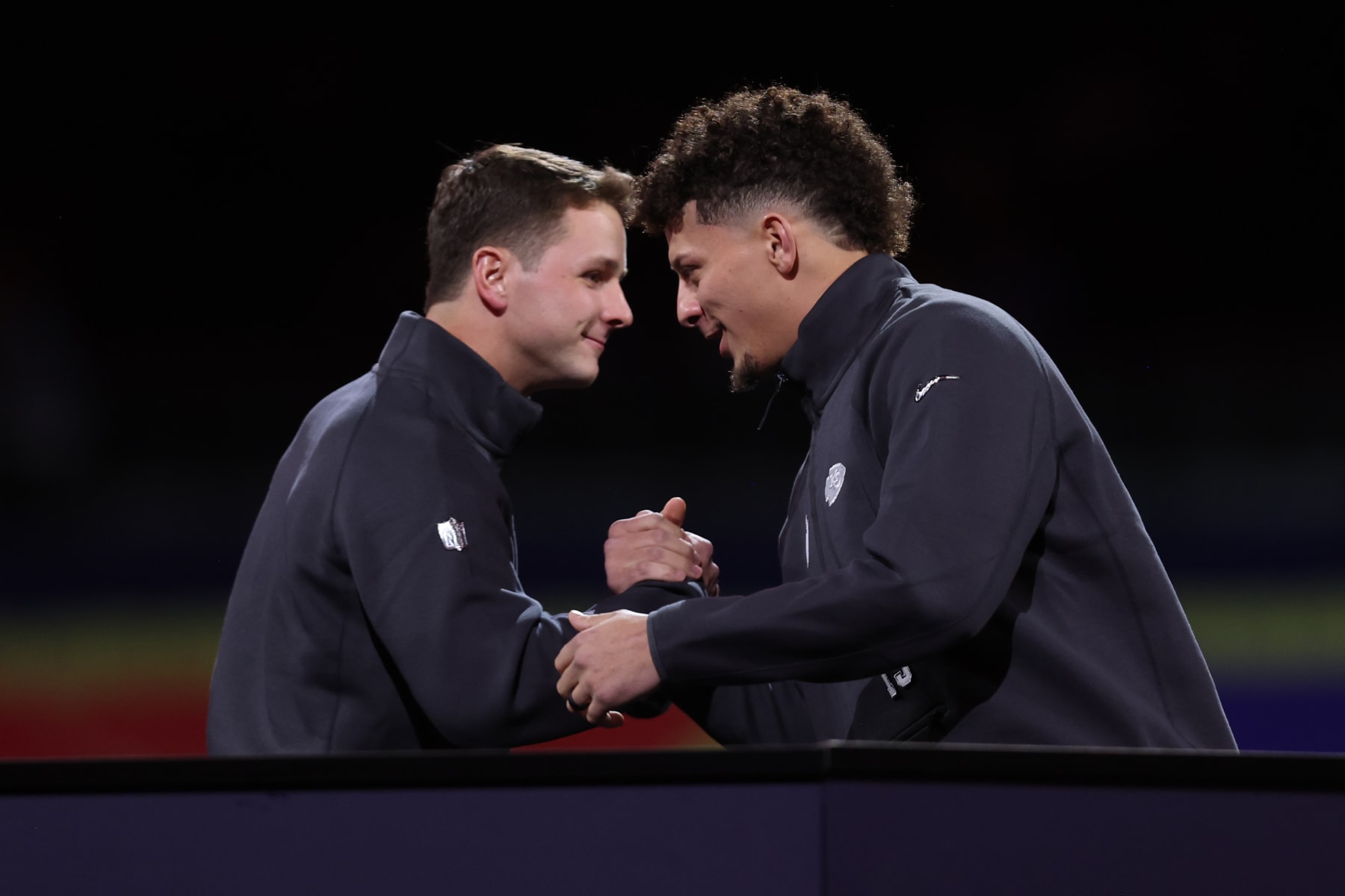 Brock Purdy and Patrick Mahomes greet each other at Super Bowl opening night.