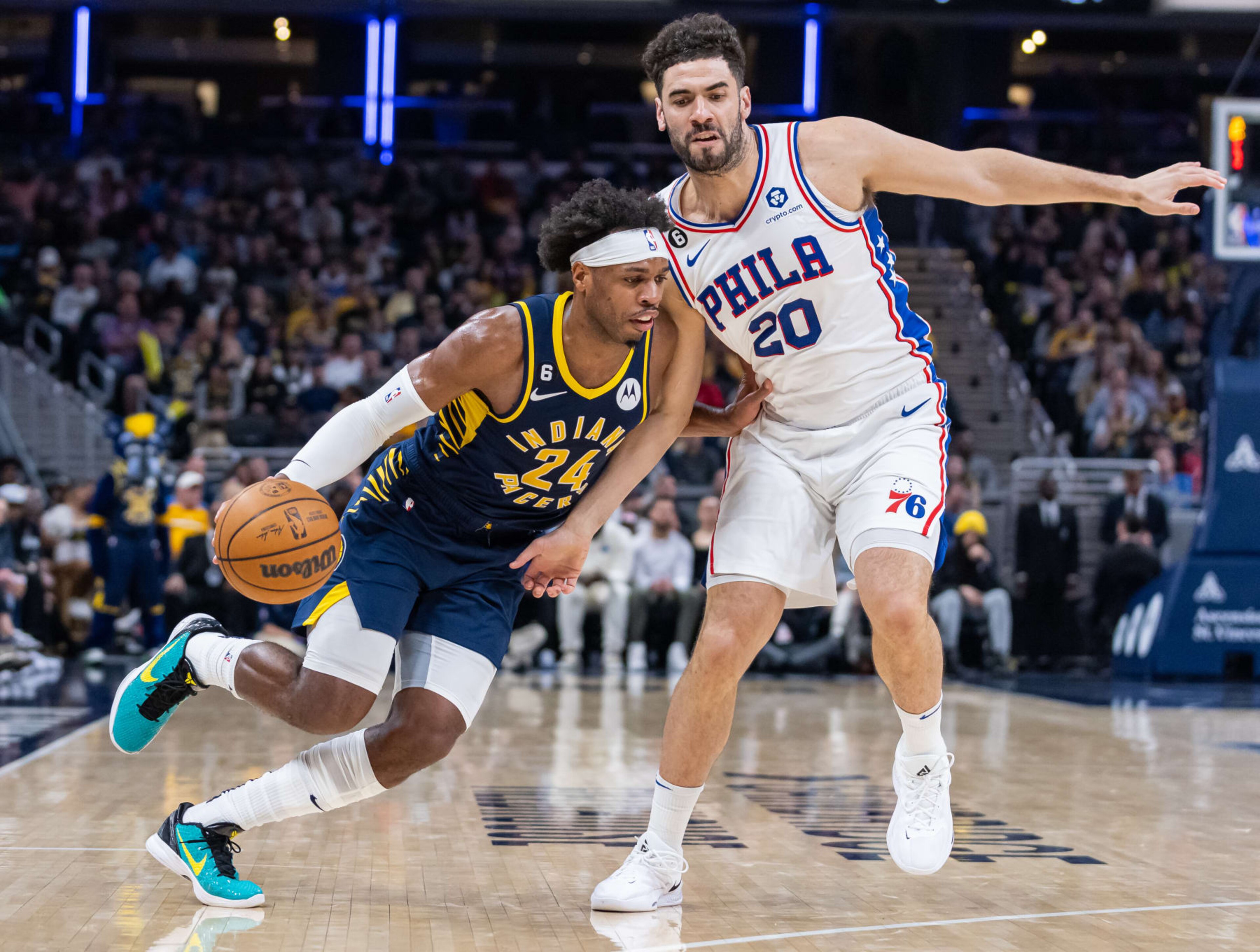 INDIANAPOLIS, IN - MARCH 06: Buddy Hield #24 of the Indiana Pacers dribbles against Georges Niang #20 of the Philadelphia 76ers at Gainbridge Fieldhouse on March 6, 2023 in Indianapolis, Indiana. NOTE TO USER: User expressly acknowledges and agrees that, by downloading and or using this photograph, User is consenting to the terms and conditions of the Getty Images License Agreement.  (Photo by Michael Hickey/Getty Images)