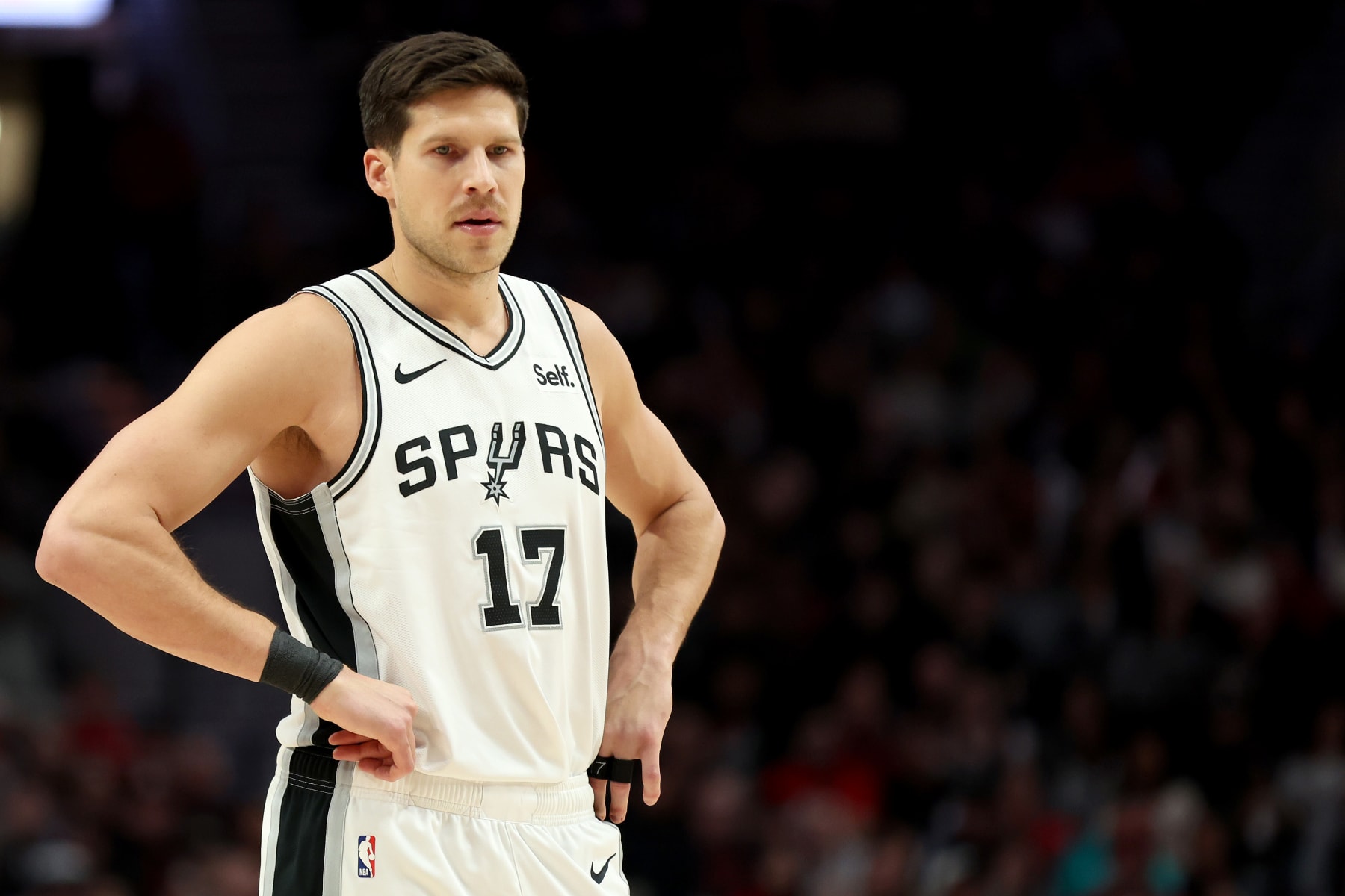 PORTLAND, OREGON - DECEMBER 28: Doug McDermott #17 of the San Antonio Spurs looks on during the fourth quarter against the Portland Trail Blazers at Moda Center on December 28, 2023 in Portland, Oregon. NOTE TO USER: User expressly acknowledges and agrees that, by downloading and or using this photograph, User is consenting to the terms and conditions of the Getty Images License Agreement. (Photo by Steph Chambers/Getty Images)
