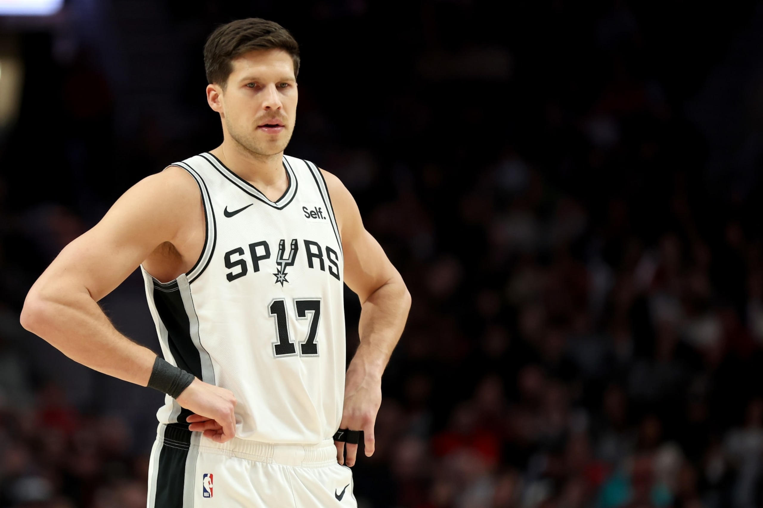 PORTLAND, OREGON - DECEMBER 28: Doug McDermott #17 of the San Antonio Spurs looks on during the fourth quarter against the Portland Trail Blazers at Moda Center on December 28, 2023 in Portland, Oregon. NOTE TO USER: User expressly acknowledges and agrees that, by downloading and or using this photograph, User is consenting to the terms and conditions of the Getty Images License Agreement. (Photo by Steph Chambers/Getty Images)