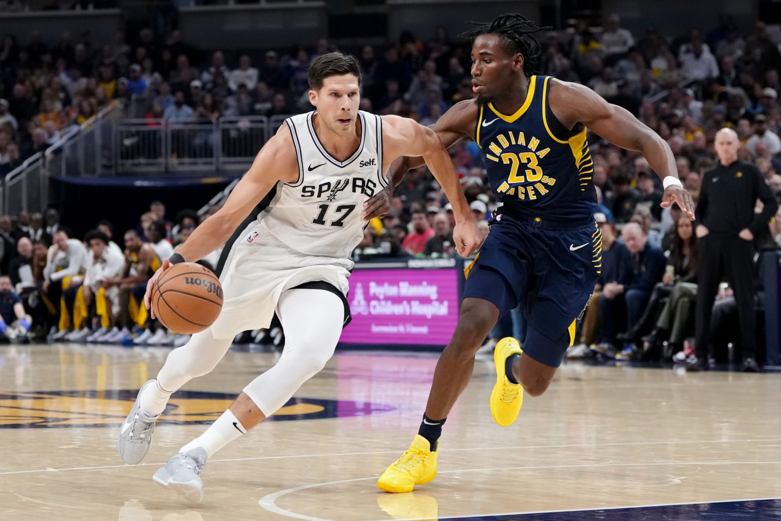 INDIANAPOLIS, INDIANA - NOVEMBER 06: Doug McDermott #17 of the San Antonio Spurs dribbles the ball while being guarded by Aaron Nesmith #23 of the Indiana Pacers in the first quarter at Gainbridge Fieldhouse on November 06, 2023 in Indianapolis, Indiana. NOTE TO USER: User expressly acknowledges and agrees that, by downloading and or using this photograph, User is consenting to the terms and conditions of the Getty Images License Agreement. (Photo by Dylan Buell/Getty Images) INDIANAPOLIS, INDIANA - NOVEMBER 06: Doug McDermott #17 of the San Antonio Spurs dribbles the ball while being guarded by Aaron Nesmith #23 of the Indiana Pacers in the first quarter at Gainbridge Fieldhouse on November 06, 2023 in Indianapolis, Indiana. NOTE TO USER: User expressly acknowledges and agrees that, by downloading and or using this photograph, User is consenting to the terms and conditions of the Getty Images License Agreement. (Photo by Dylan Buell/Getty Images)