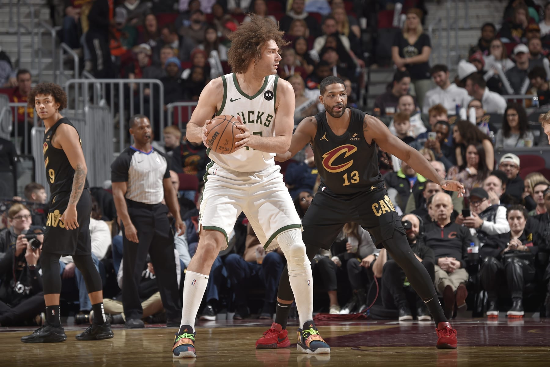 CLEVELAND, OH - JANUARY 17: Robin Lopez #42 of the Milwaukee Bucks looks to pass the ball during the game against the Cleveland Cavaliers on January 17, 2024 at Rocket Mortgage FieldHouse in Cleveland, Ohio. NOTE TO USER: User expressly acknowledges and agrees that, by downloading and/or using this Photograph, user is consenting to the terms and conditions of the Getty Images License Agreement. Mandatory Copyright Notice: Copyright 2024 NBAE (Photo by David Liam Kyle/NBAE via Getty Images)