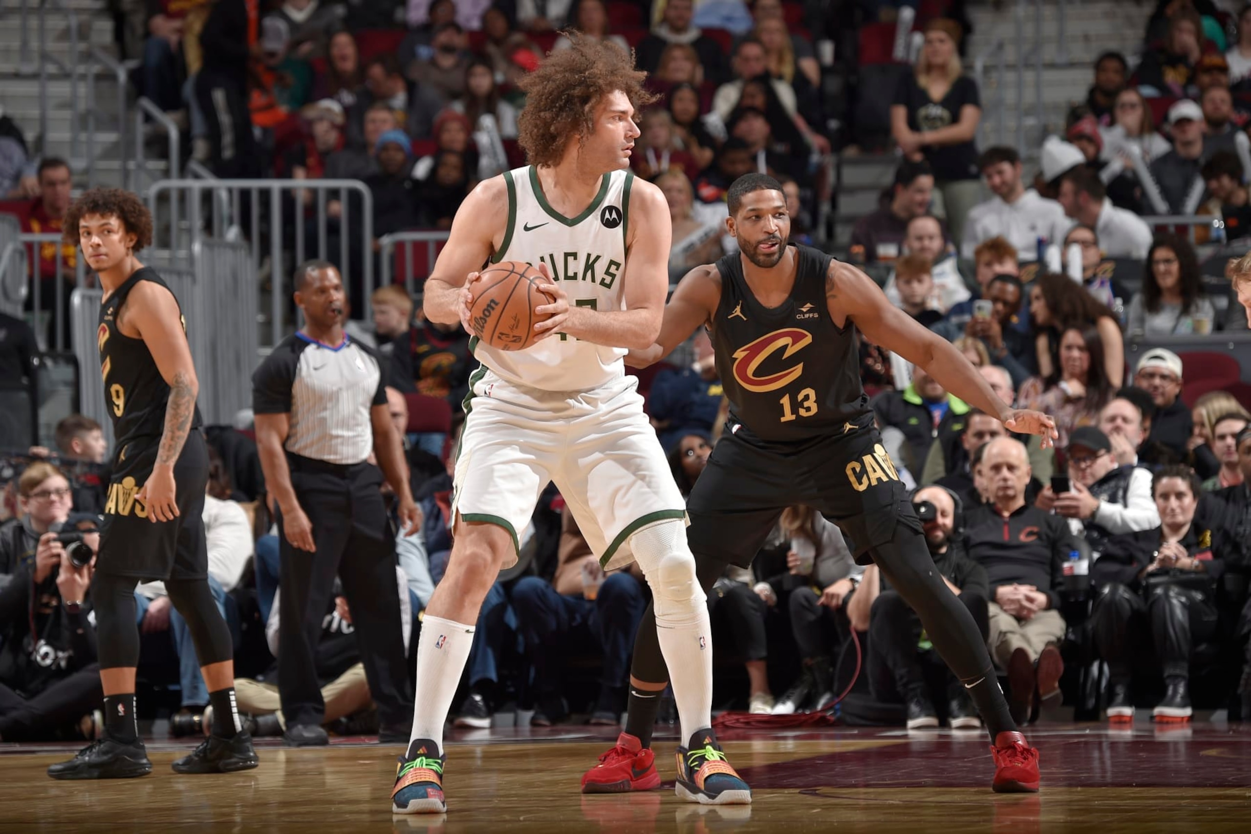 CLEVELAND, OH - JANUARY 17: Robin Lopez #42 of the Milwaukee Bucks looks to pass the ball during the game against the Cleveland Cavaliers on January 17, 2024 at Rocket Mortgage FieldHouse in Cleveland, Ohio. NOTE TO USER: User expressly acknowledges and agrees that, by downloading and/or using this Photograph, user is consenting to the terms and conditions of the Getty Images License Agreement. Mandatory Copyright Notice: Copyright 2024 NBAE (Photo by David Liam Kyle/NBAE via Getty Images)