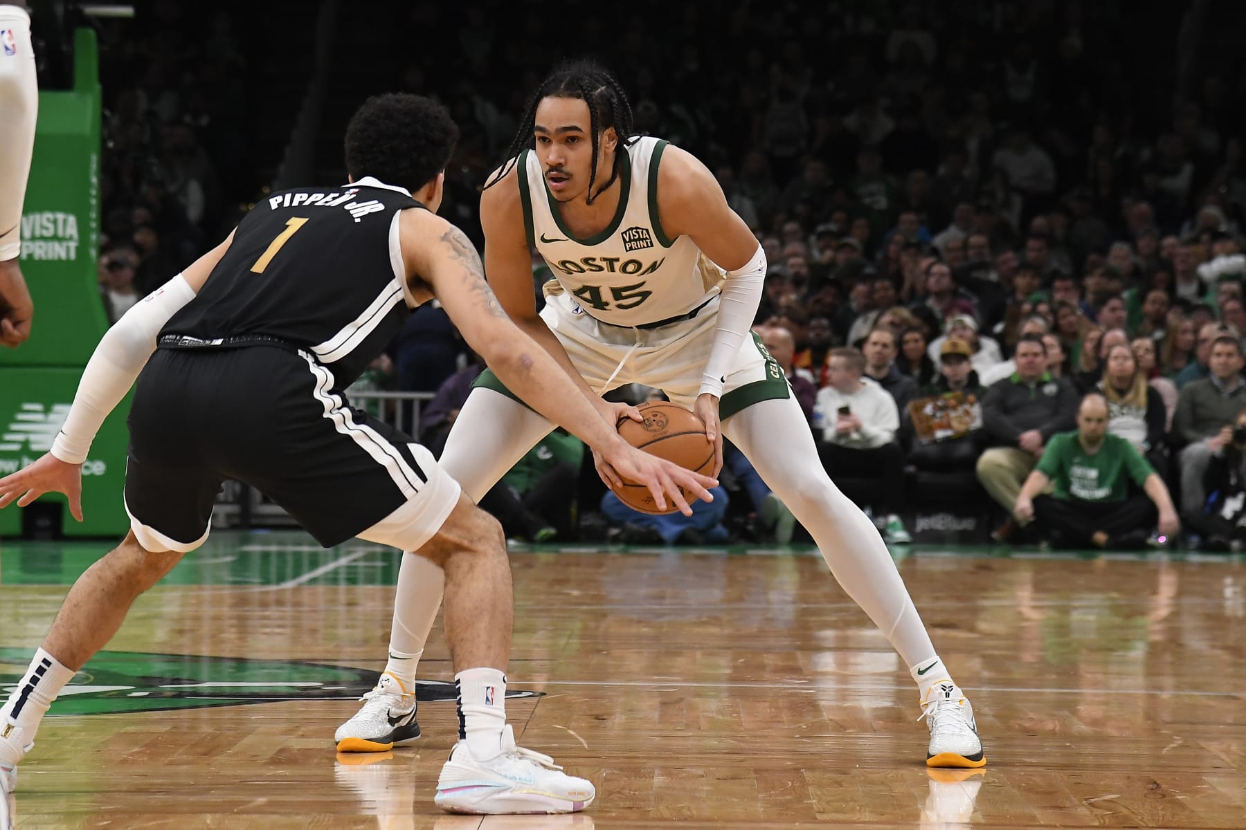 BOSTON, MA - FEBRUARY 4:  Dalano Banton #45 of the Boston Celtics handles the ball during the game against the Memphis Grizzlies on February 4, 2024 at the TD Garden in Boston, Massachusetts. NOTE TO USER: User expressly acknowledges and agrees that, by downloading and or using this photograph, User is consenting to the terms and conditions of the Getty Images License Agreement. Mandatory Copyright Notice: Copyright 2024 NBAE  (Photo by Brian Babineau/NBAE via Getty Images)