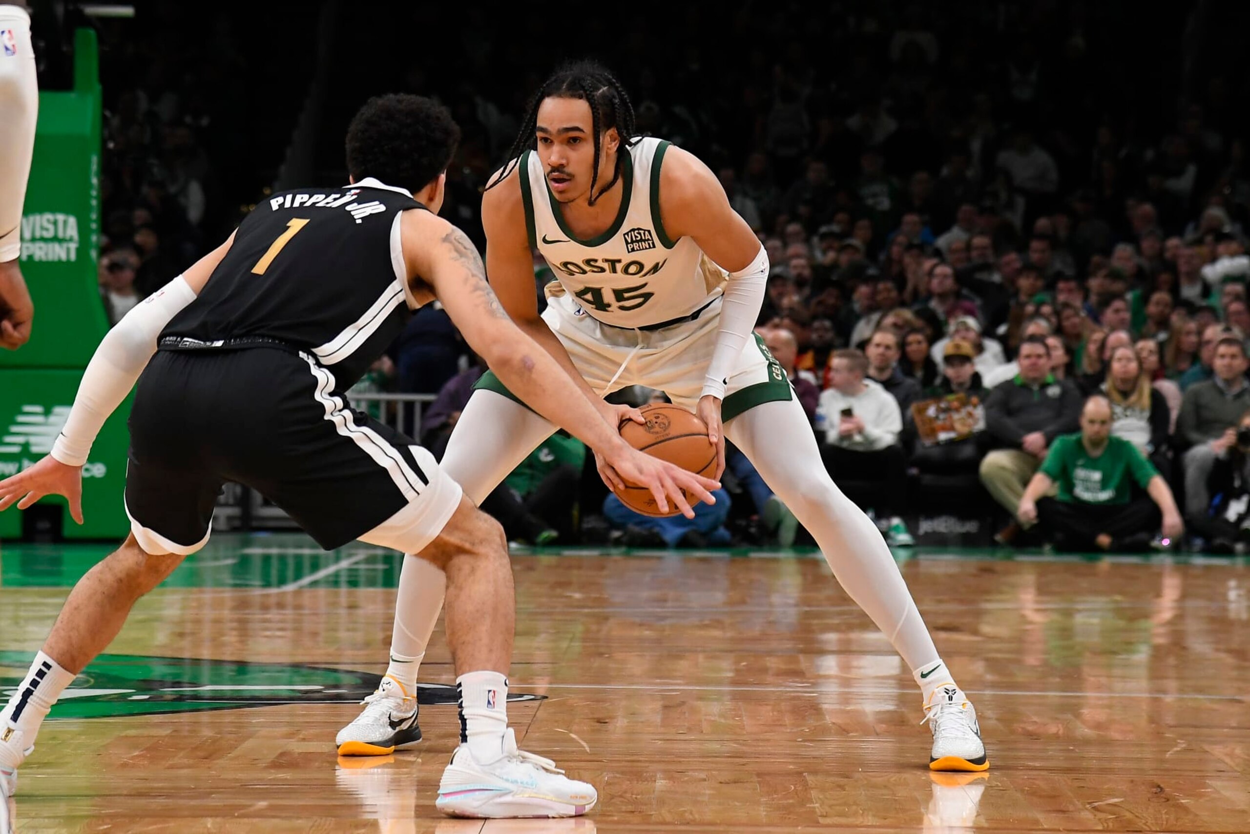 BOSTON, MA - FEBRUARY 4:  Dalano Banton #45 of the Boston Celtics handles the ball during the game against the Memphis Grizzlies on February 4, 2024 at the TD Garden in Boston, Massachusetts. NOTE TO USER: User expressly acknowledges and agrees that, by downloading and or using this photograph, User is consenting to the terms and conditions of the Getty Images License Agreement. Mandatory Copyright Notice: Copyright 2024 NBAE  (Photo by Brian Babineau/NBAE via Getty Images)