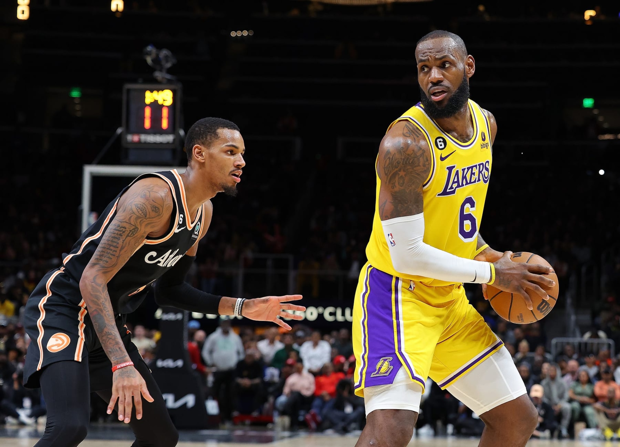 ATLANTA, GEORGIA - DECEMBER 30: LeBron James #6 of the Los Angeles Lakers looks to drive against Dejounte Murray #5 of the Atlanta Hawks during the fourth quarter at State Farm Arena on December 30, 2022 in Atlanta, Georgia. NOTE TO USER: User expressly acknowledges and agrees that, by downloading and or using this photograph, User is consenting to the terms and conditions of the Getty Images License Agreement. (Photo by Kevin C. Cox/Getty Images) ATLANTA, GEORGIA - DECEMBER 30: LeBron James #6 of the Los Angeles Lakers looks to drive against Dejounte Murray #5 of the Atlanta Hawks during the fourth quarter at State Farm Arena on December 30, 2022 in Atlanta, Georgia. NOTE TO USER: User expressly acknowledges and agrees that, by downloading and or using this photograph, User is consenting to the terms and conditions of the Getty Images License Agreement. (Photo by Kevin C. Cox/Getty Images)