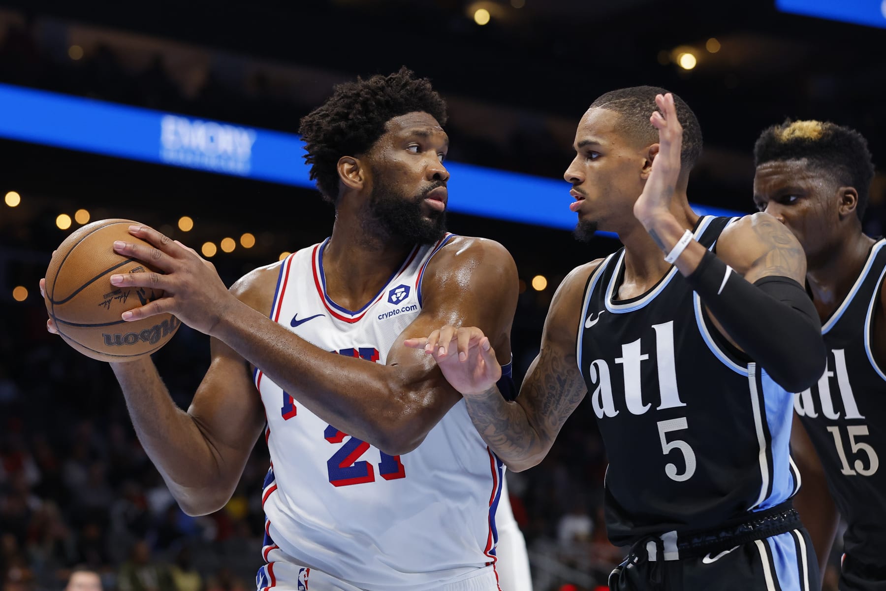 ATLANTA, GEORGIA - NOVEMBER 17: Joel Embiid #21 of the Philadelphia 76ers looks to pass around Dejounte Murray #5 of the Atlanta Hawks during the second half of an NBA In-Season Tournament game at State Farm Arena on November 17, 2023 in Atlanta, Georgia. NOTE TO USER: User expressly acknowledges and agrees that, by downloading and or using this photograph, User is consenting to the terms and conditions of the Getty Images License Agreement. (Photo by Todd Kirkland/Getty Images)