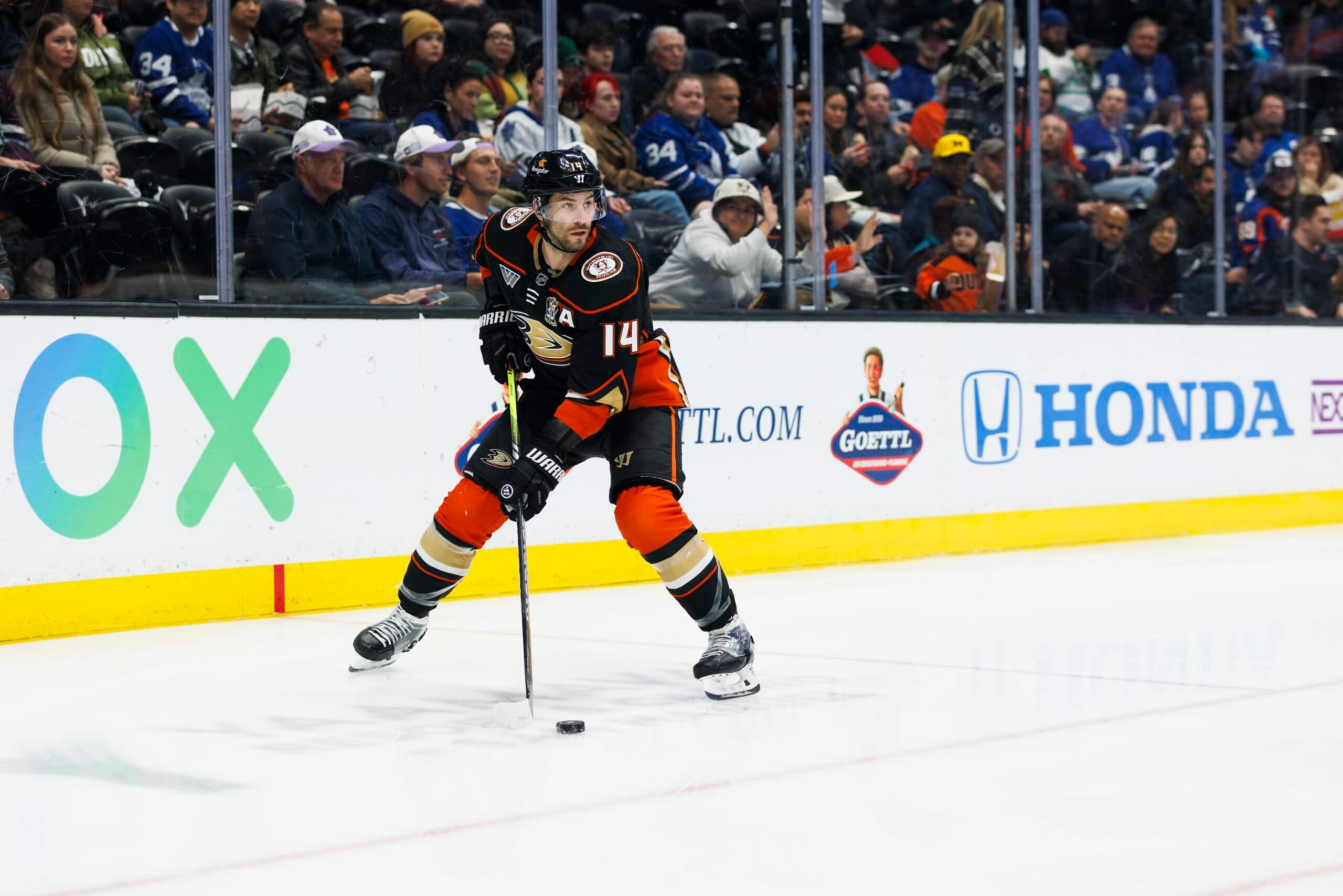 ANAHEIM, CA - JANUARY 03: Anaheim Ducks center Adam Henrique (14) skates with the puck during an NHL hockey game against the Toronto Maple Leafs on January 3, 2024 at Honda Center in Anaheim, CA. (Photo by Ric Tapia/Icon Sportswire via Getty Images)