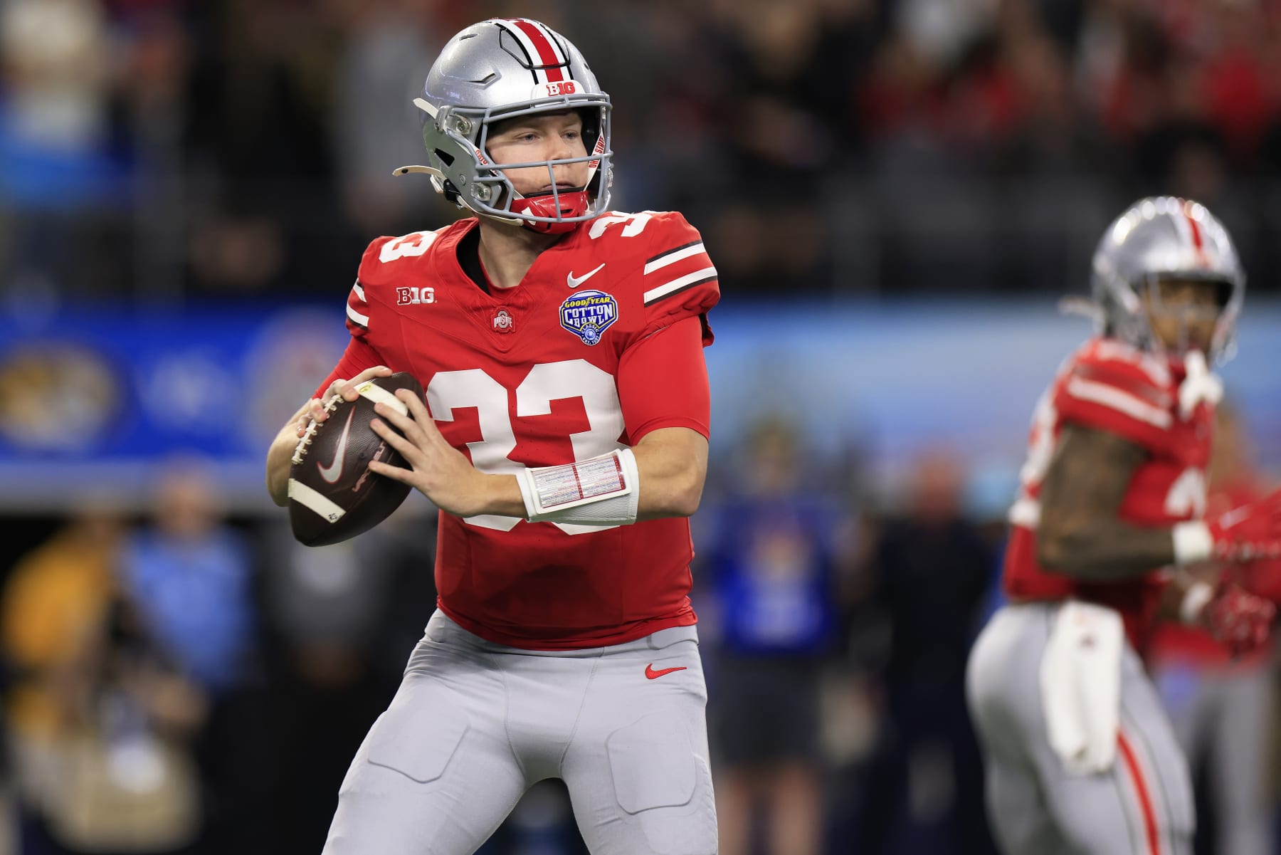 ARLINGTON, TEXAS - DECEMBER 29: Devin Brown #33 of the Ohio State Buckeyes looks to throw the ball during the first quarter against the Missouri Tigers during the Goodyear Cotton Bowl at AT&T Stadium on December 29, 2023 in Arlington, Texas. (Photo by Ron Jenkins/Getty Images)