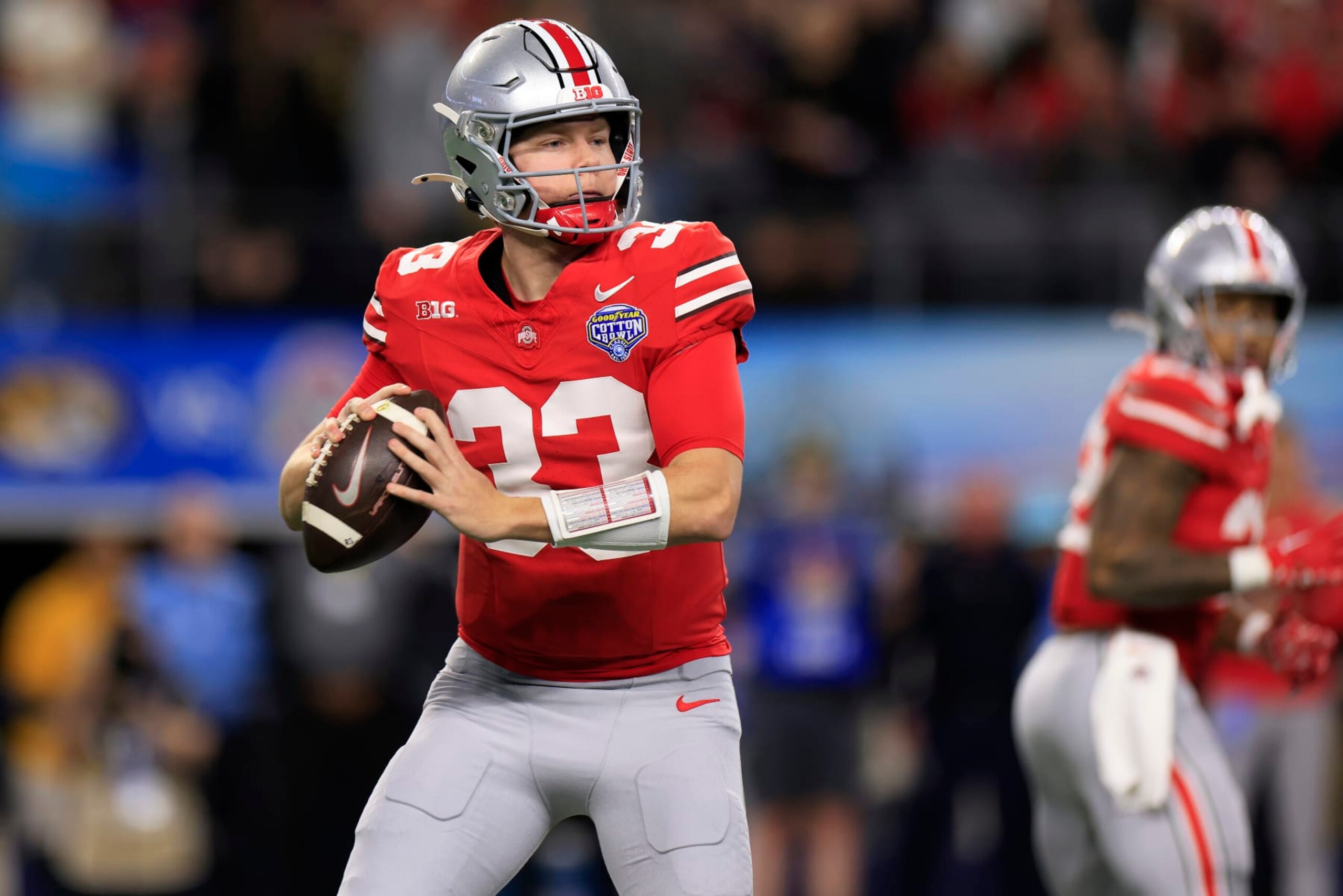 ARLINGTON, TEXAS - DECEMBER 29: Devin Brown #33 of the Ohio State Buckeyes looks to throw the ball during the first quarter against the Missouri Tigers during the Goodyear Cotton Bowl at AT&T Stadium on December 29, 2023 in Arlington, Texas. (Photo by Ron Jenkins/Getty Images)