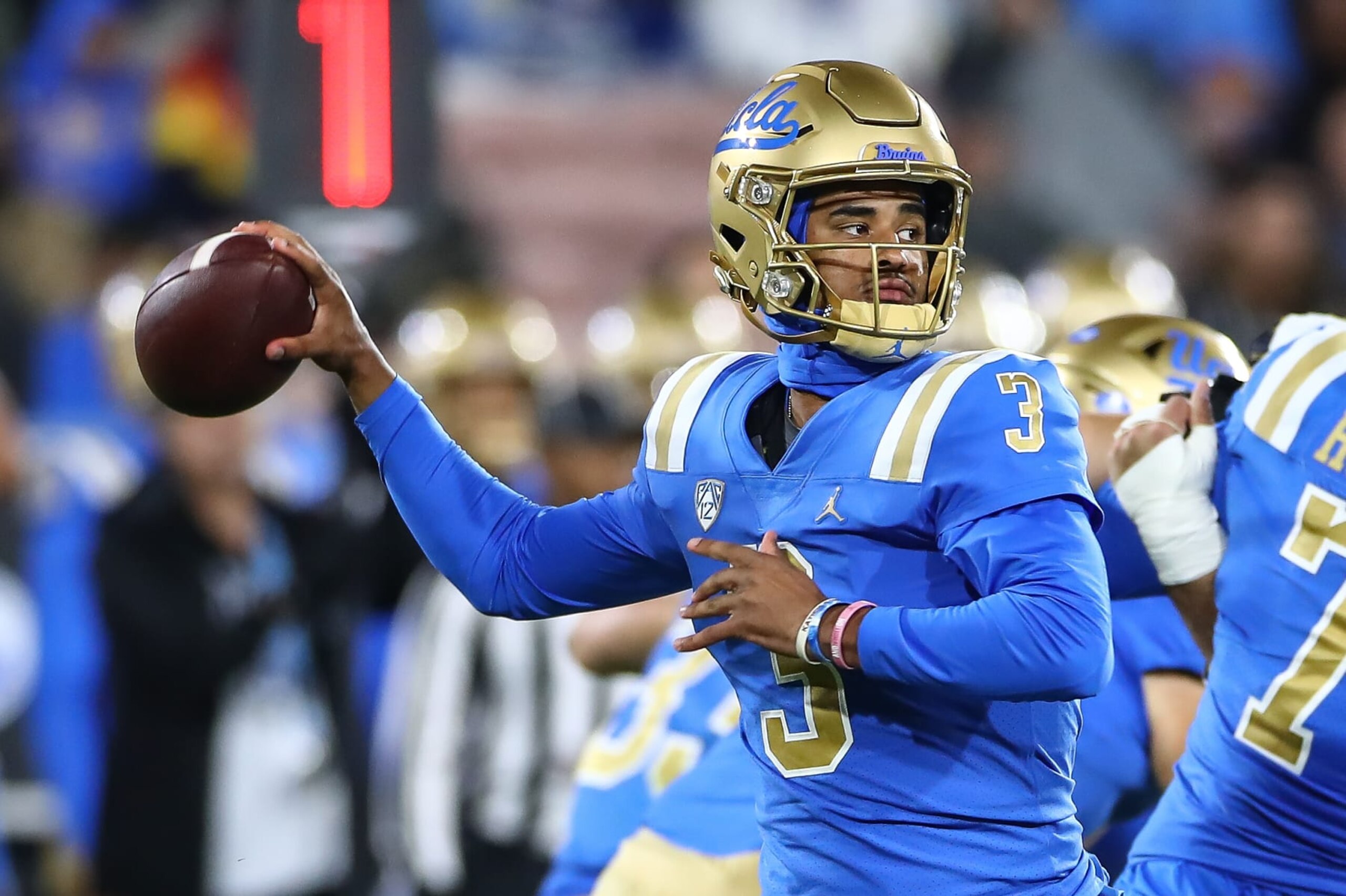 PASADENA, CA - NOVEMBER 25: UCLA Bruins quarterback Dante Moore (3) throws a pass during Cal Bears game versus the UCLA Bruins in the last Pac-12 Conference football game played on November 25, 2023, at the Rose Bowl Stadium in Pasadena, CA. (Photo by Jevone Moore/Icon Sportswire via Getty Images)