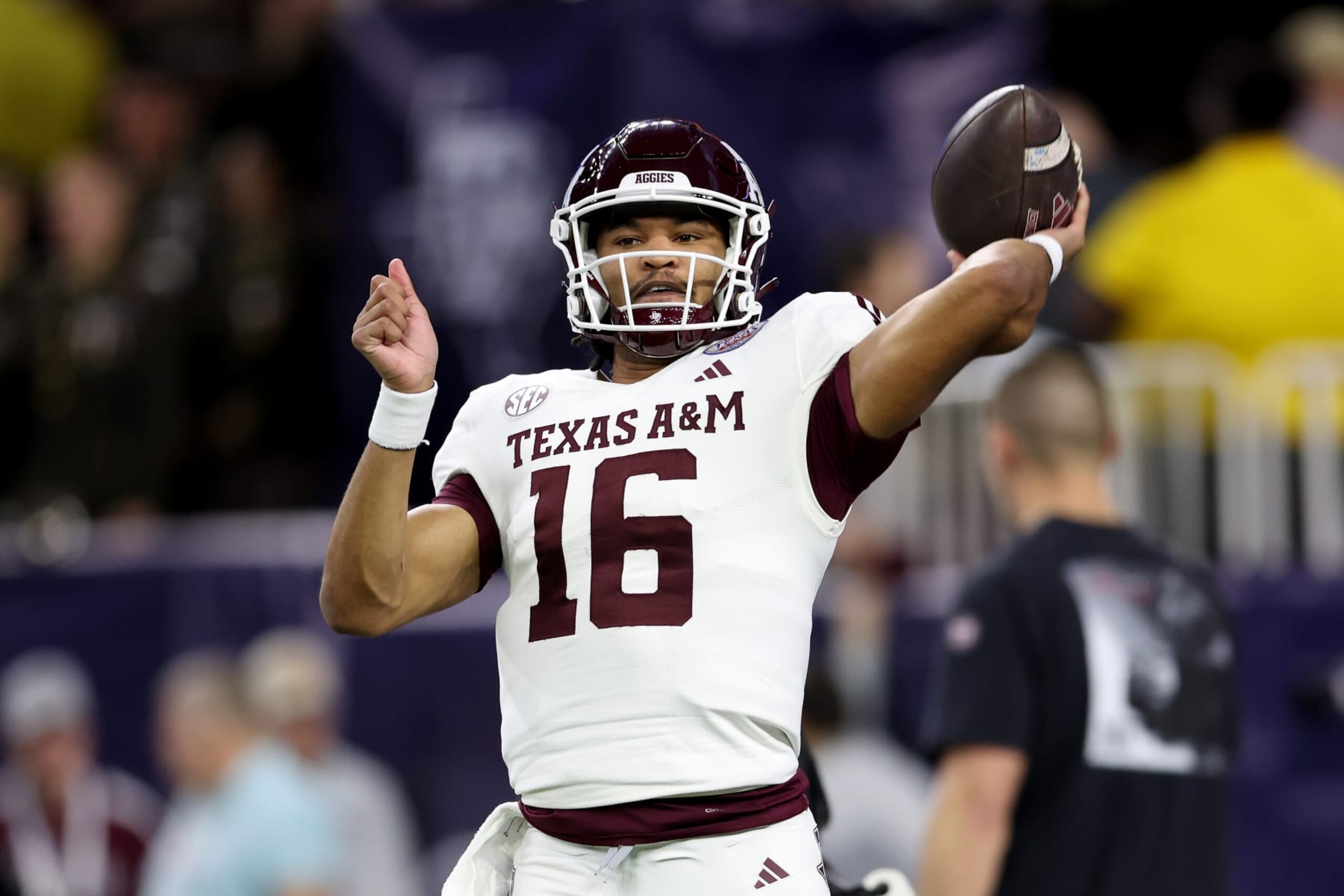 HOUSTON, TEXAS - DECEMBER 27: Jaylen Henderson #16 of the Texas A&M Aggies warms up before the TaxAct Texas Bowl \ao at NRG Stadium on December 27, 2023 in Houston, Texas. (Photo by Tim Warner/Getty Images)
