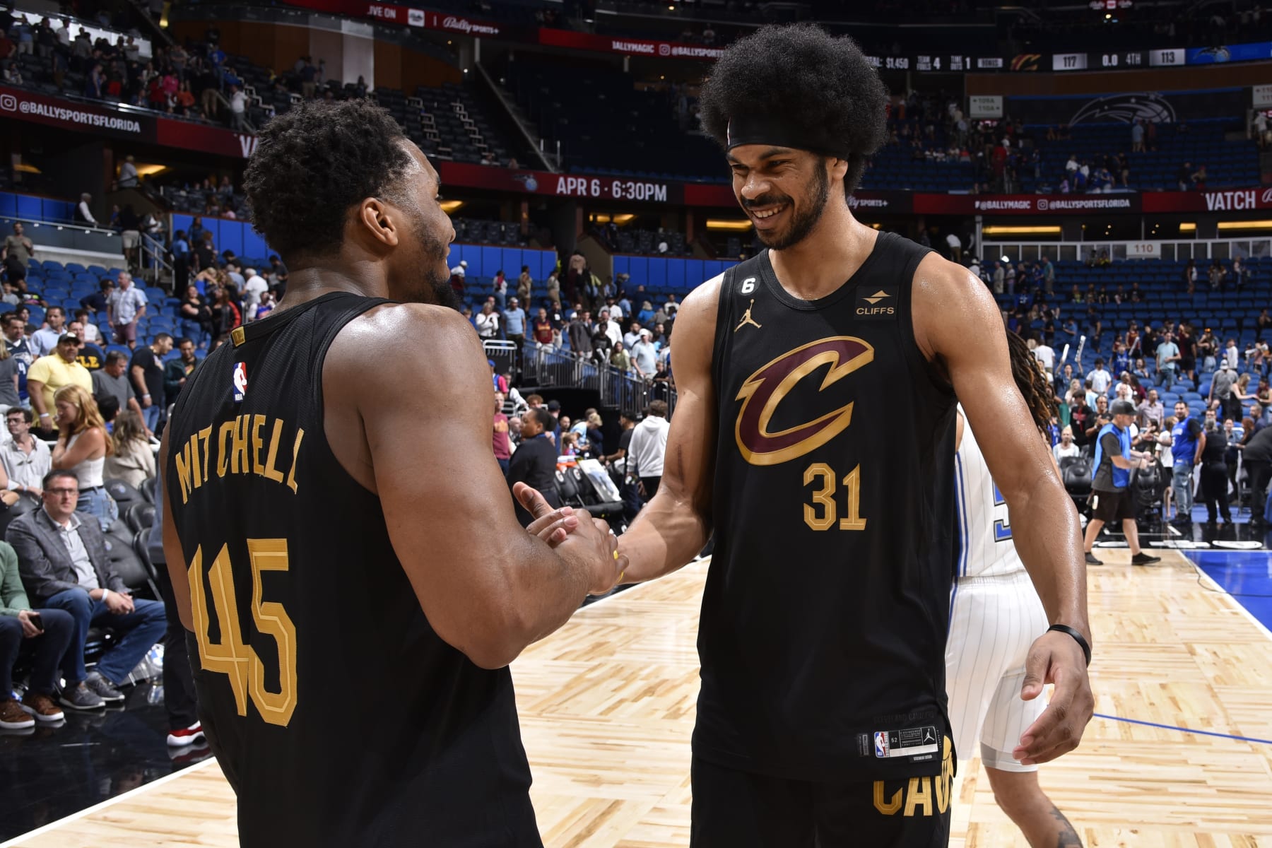 ORLANDO, FL - APRIL 4: Donovan Mitchell #45 and Jarrett Allen #31 of the Cleveland Cavaliers high five after the game against the Cleveland Cavaliers on April 4, 2023 at Amway Center in Orlando, Florida. NOTE TO USER: User expressly acknowledges and agrees that, by downloading and or using this photograph, User is consenting to the terms and conditions of the Getty Images License Agreement. Mandatory Copyright Notice: Copyright 2023 NBAE (Photo by Fernando Medina/NBAE via Getty Images)