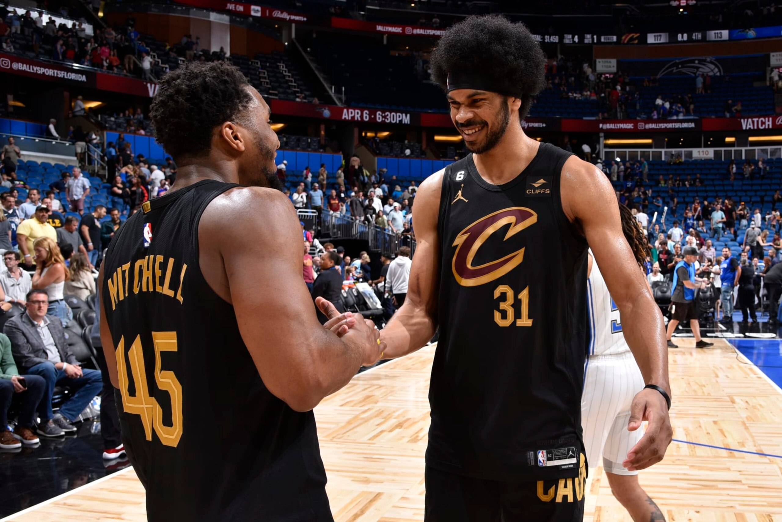 ORLANDO, FL - APRIL 4: Donovan Mitchell #45 and Jarrett Allen #31 of the Cleveland Cavaliers high five after the game against the Cleveland Cavaliers on April 4, 2023 at Amway Center in Orlando, Florida. NOTE TO USER: User expressly acknowledges and agrees that, by downloading and or using this photograph, User is consenting to the terms and conditions of the Getty Images License Agreement. Mandatory Copyright Notice: Copyright 2023 NBAE (Photo by Fernando Medina/NBAE via Getty Images)