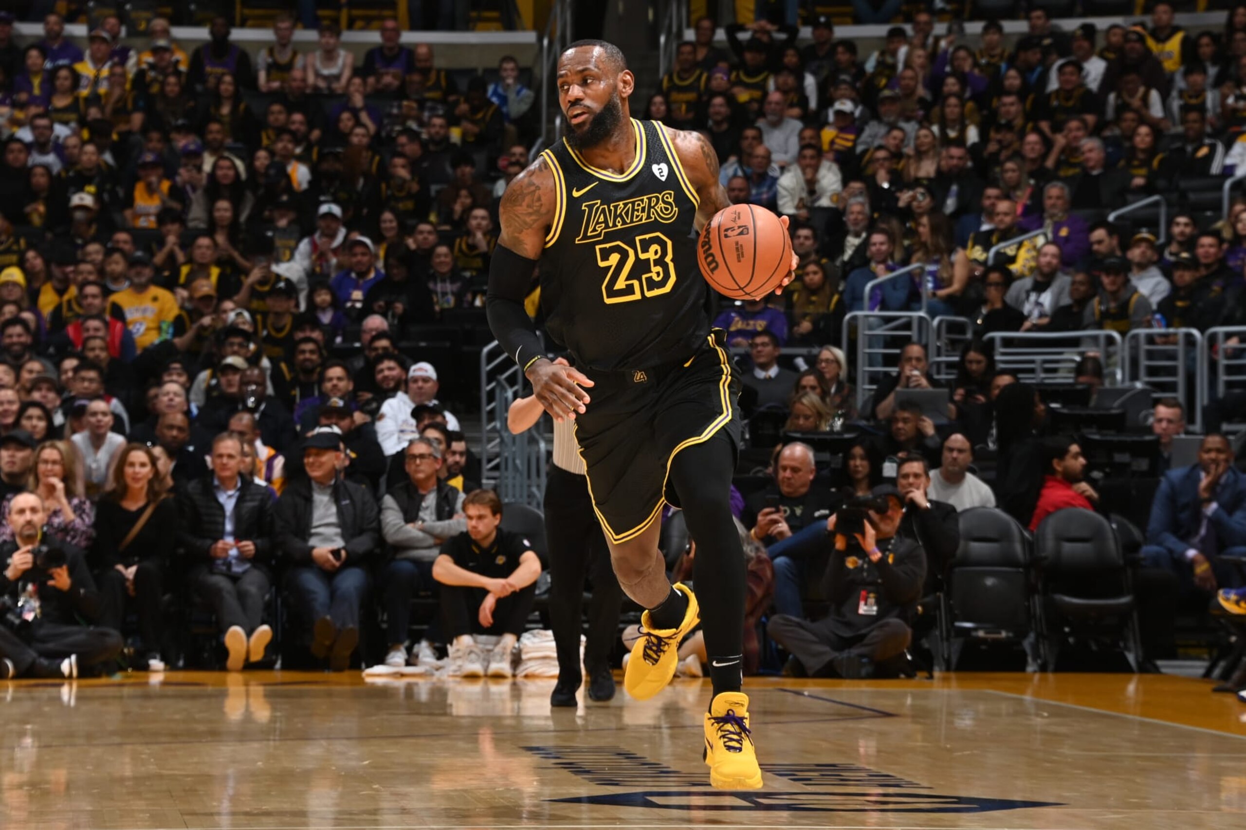 LOS ANGELES, CA - FEBRUARY 8: LeBron James #23 of the Los Angeles Lakers dribbles the ball during the game against the Denver Nuggets on Feburary 8, 2024 at Crypto.Com Arena in Los Angeles, California. NOTE TO USER: User expressly acknowledges and agrees that, by downloading and/or using this Photograph, user is consenting to the terms and conditions of the Getty Images License Agreement. Mandatory Copyright Notice: Copyright 2024 NBAE (Photo by Andrew D. Bernstein/NBAE via Getty Images)