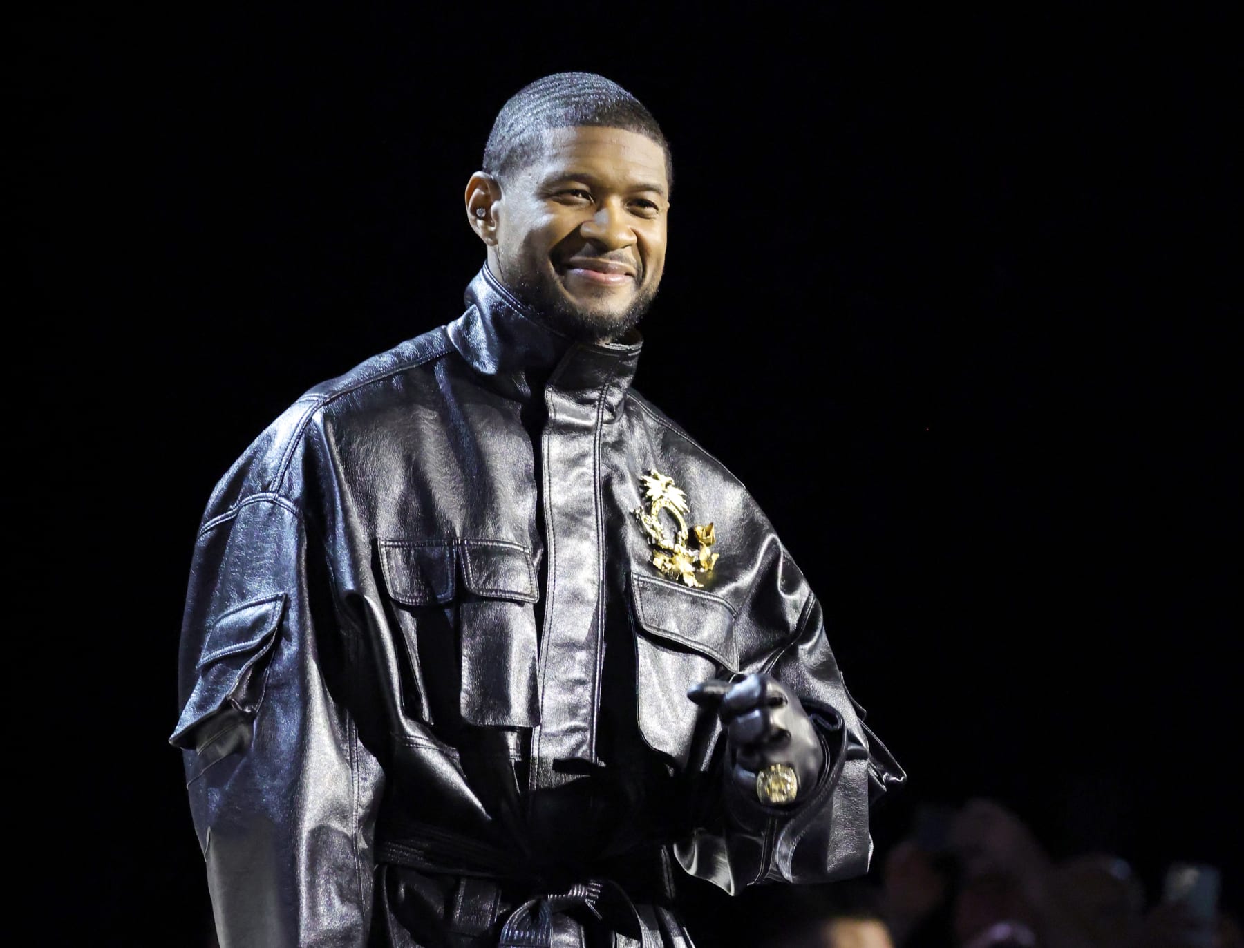 LAS VEGAS, NEVADA - FEBRUARY 08: Usher speaks onstage during the Super Bowl LVIII Pregame & Apple Music Super Bowl LVIII Halftime Show press conference at the Mandalay Bay Convention Center on February 08, 2024 in Las Vegas, Nevada. (Photo by Ethan Miller/Getty Images)