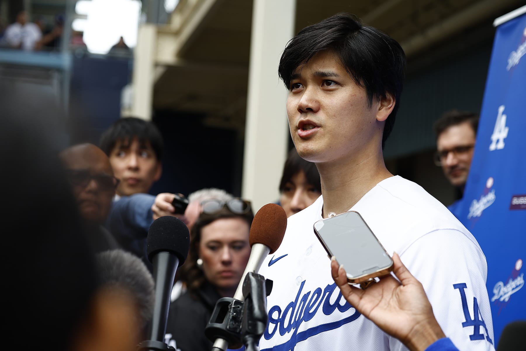 LOS ANGELES, CALIFORNIA - FEBRUARY 03:  Shohei Ohtani #17 of the Los Angeles Dodgers speaks with the media during DodgerFest at Dodger Stadium on February 03, 2024 in Los Angeles, California. (Photo by Ronald Martinez/Getty Images)