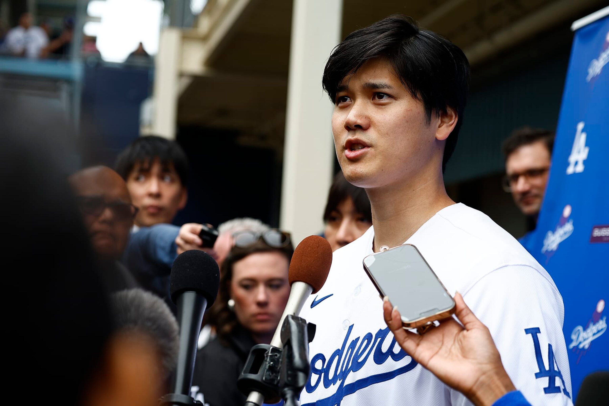LOS ANGELES, CALIFORNIA - FEBRUARY 03:  Shohei Ohtani #17 of the Los Angeles Dodgers speaks with the media during DodgerFest at Dodger Stadium on February 03, 2024 in Los Angeles, California. (Photo by Ronald Martinez/Getty Images)