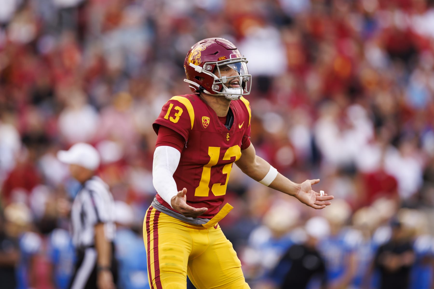 LOS ANGELES, CALIFORNIA - NOVEMBER 18: Caleb Williams #13 of the USC Trojans reacts during the first half of a game against the UCLA Bruins at United Airlines Field at the Los Angeles Memorial Coliseum on November 18, 2023 in Los Angeles, California. (Photo by Ryan Kang/Getty Images)