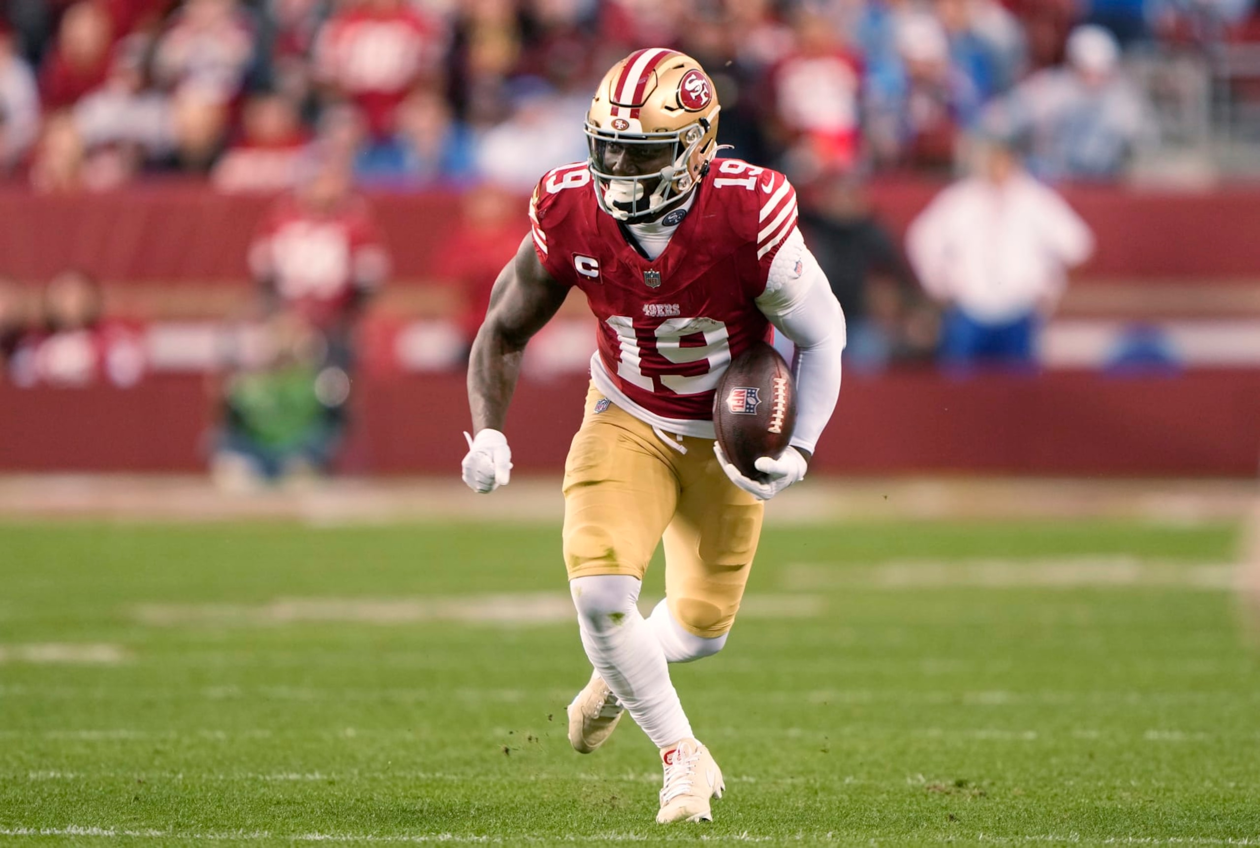 SANTA CLARA, CALIFORNIA - JANUARY 28: Deebo Samuel #19 of the San Francisco 49ers runs with the ball during the third quarter against the Detroit Lions in the NFC Championship Game at Levi's Stadium on January 28, 2024 in Santa Clara, California. (Photo by Thearon W. Henderson/Getty Images)