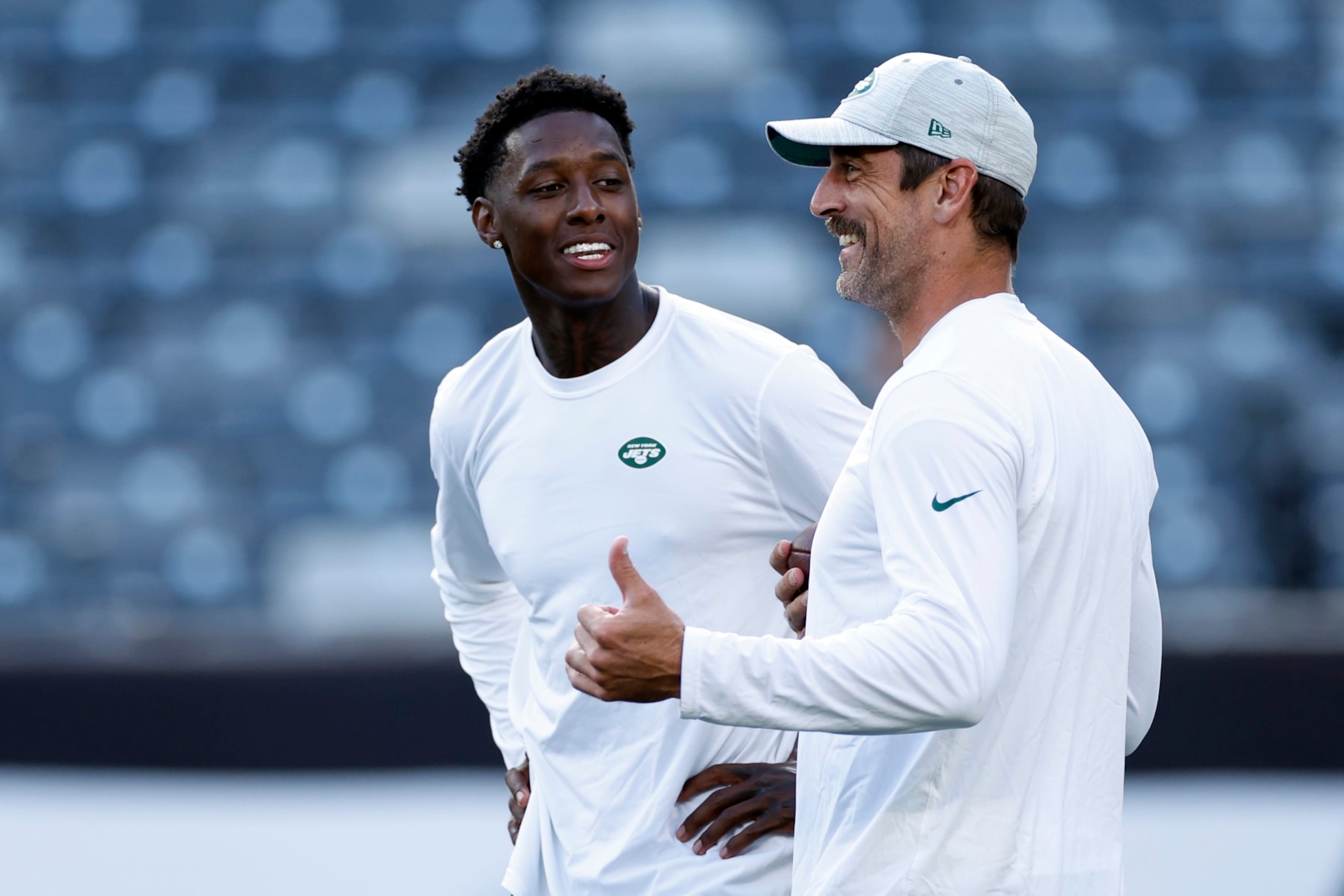 EAST RUTHERFORD, NEW JERSEY - AUGUST 19: Sauce Gardner #1 (L) talks with Aaron Rodgers #8 of the New York Jets during warmups before the first half of a preseason game against the Tampa Bay Buccaneers at MetLife Stadium on August 19, 2023 in East Rutherford, New Jersey. (Photo by Sarah Stier/Getty Images)