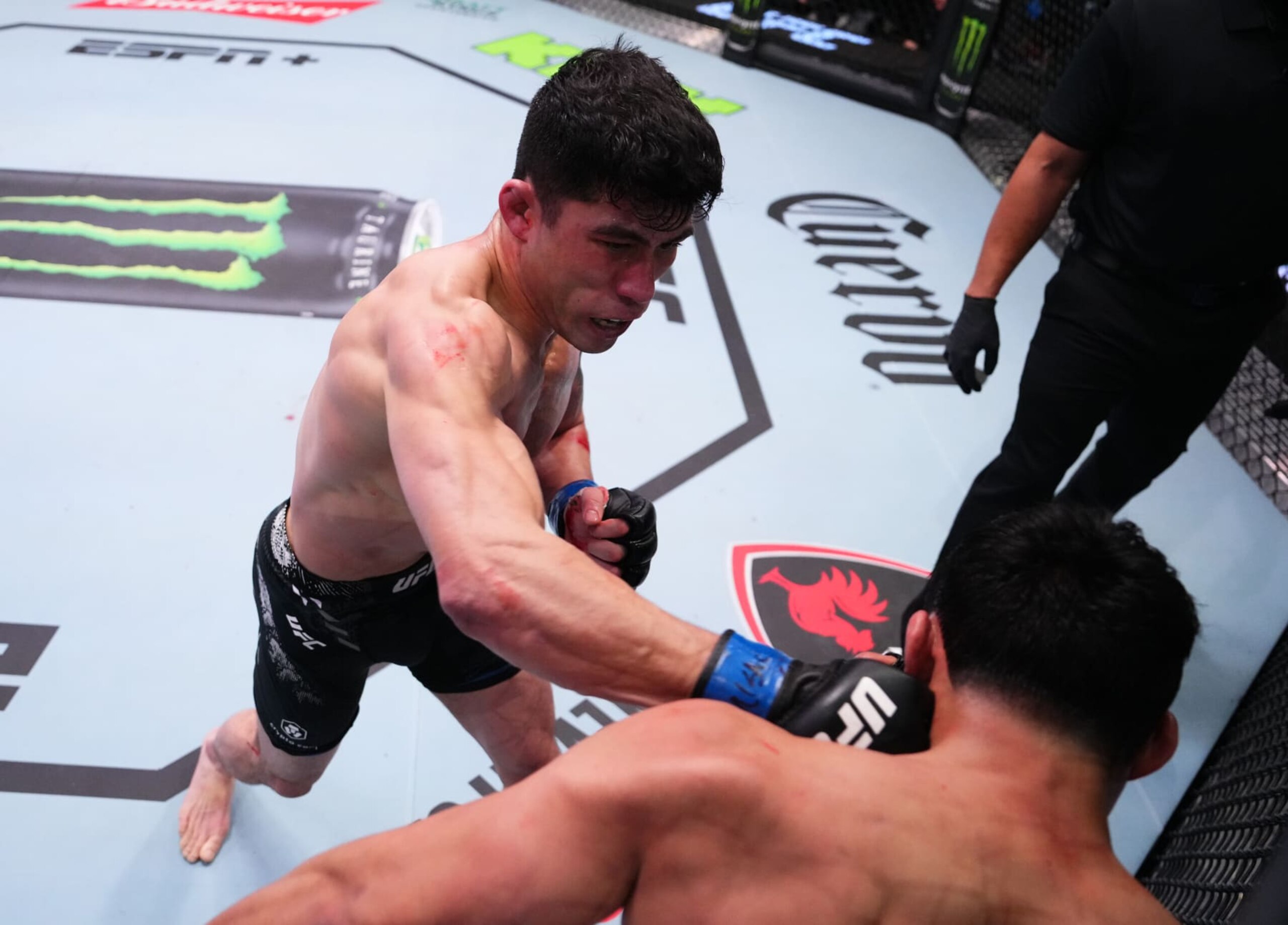 LAS VEGAS, NEVADA - FEBRUARY 10: (L-R) Hyder Amil of the Philippines punches Fernie Garcia in a featherweight fight during the UFC Fight Night event at UFC APEX on February 10, 2024 in Las Vegas, Nevada. (Photo by Jeff Bottari/Zuffa LLC via Getty Images)