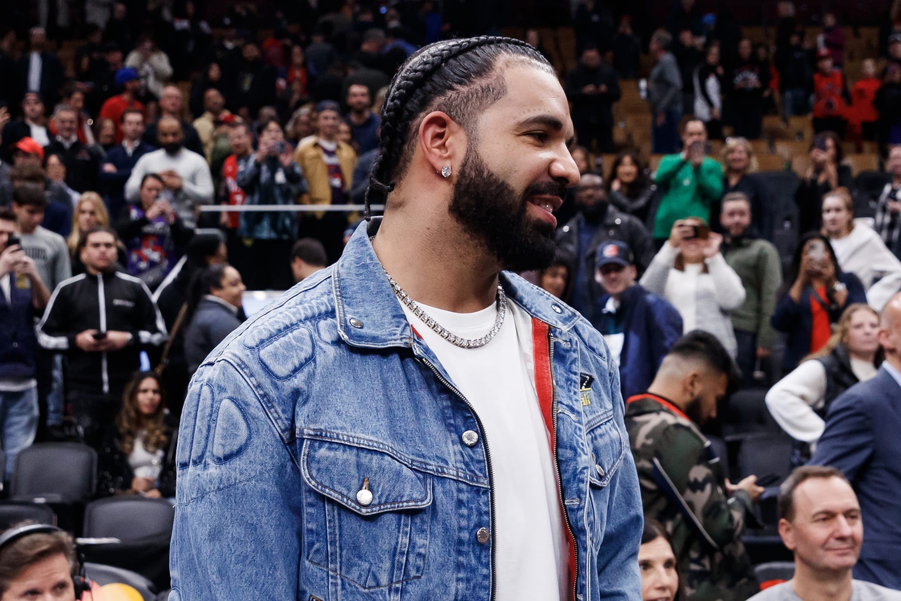 TORONTO, CANADA - NOVEMBER 17: Rapper Drake greets Jayson Tatum #0 of the Boston Celtics after their NBA In-Season Tournament game against the Toronto Raptors at Scotiabank Arena on November 17, 2023 in Toronto, Canada. NOTE TO USER: User expressly acknowledges and agrees that, by downloading and or using this photograph, User is consenting to the terms and conditions of the Getty Images License Agreement. (Photo by Cole Burston/Getty Images)