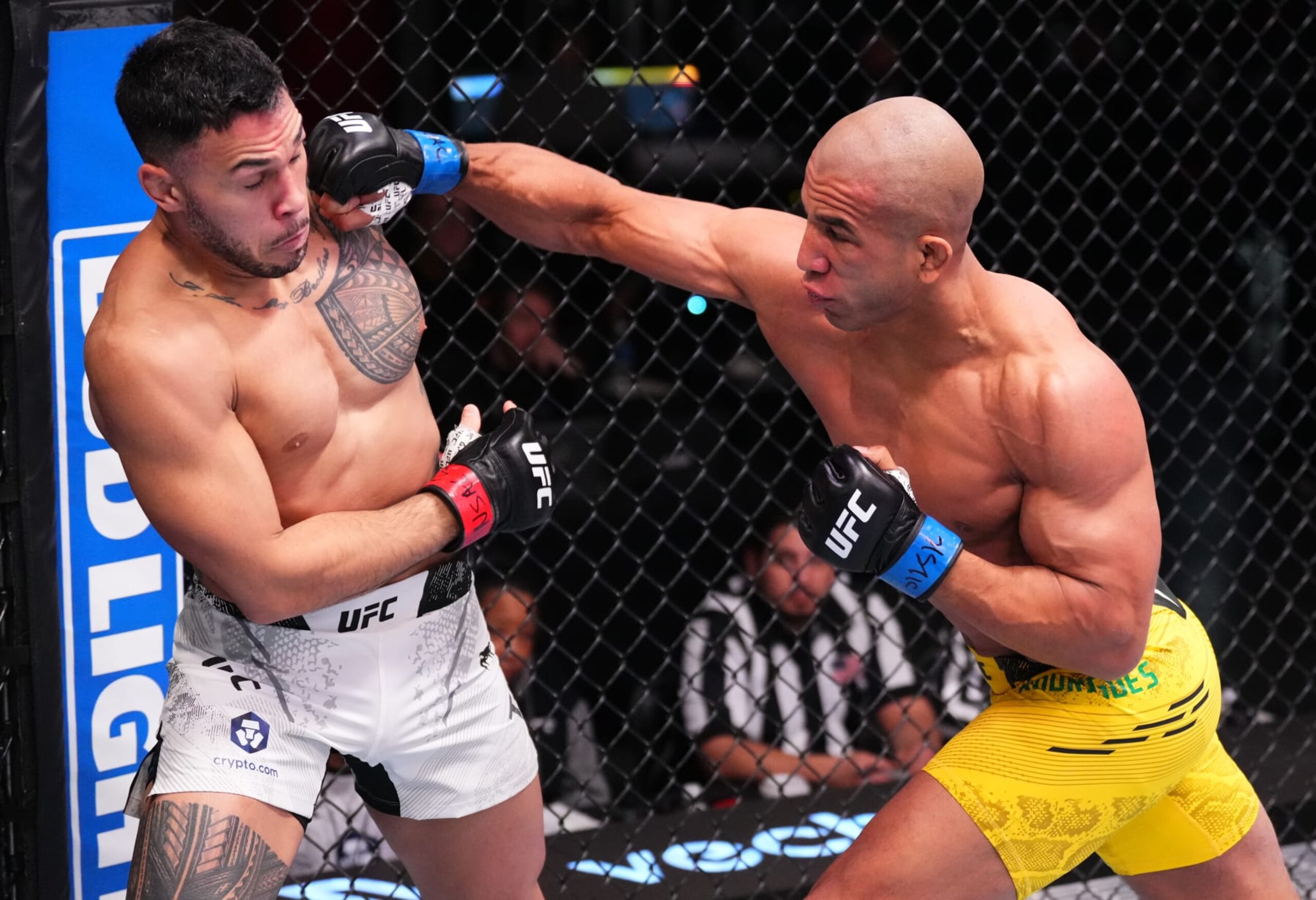 LAS VEGAS, NEVADA - FEBRUARY 10: (R-L) Gregory Rodrigues of Brazil punches Brad Tavares in a middleweight fight during the UFC Fight Night event at UFC APEX on February 10, 2024 in Las Vegas, Nevada. (Photo by Jeff Bottari/Zuffa LLC via Getty Images)
