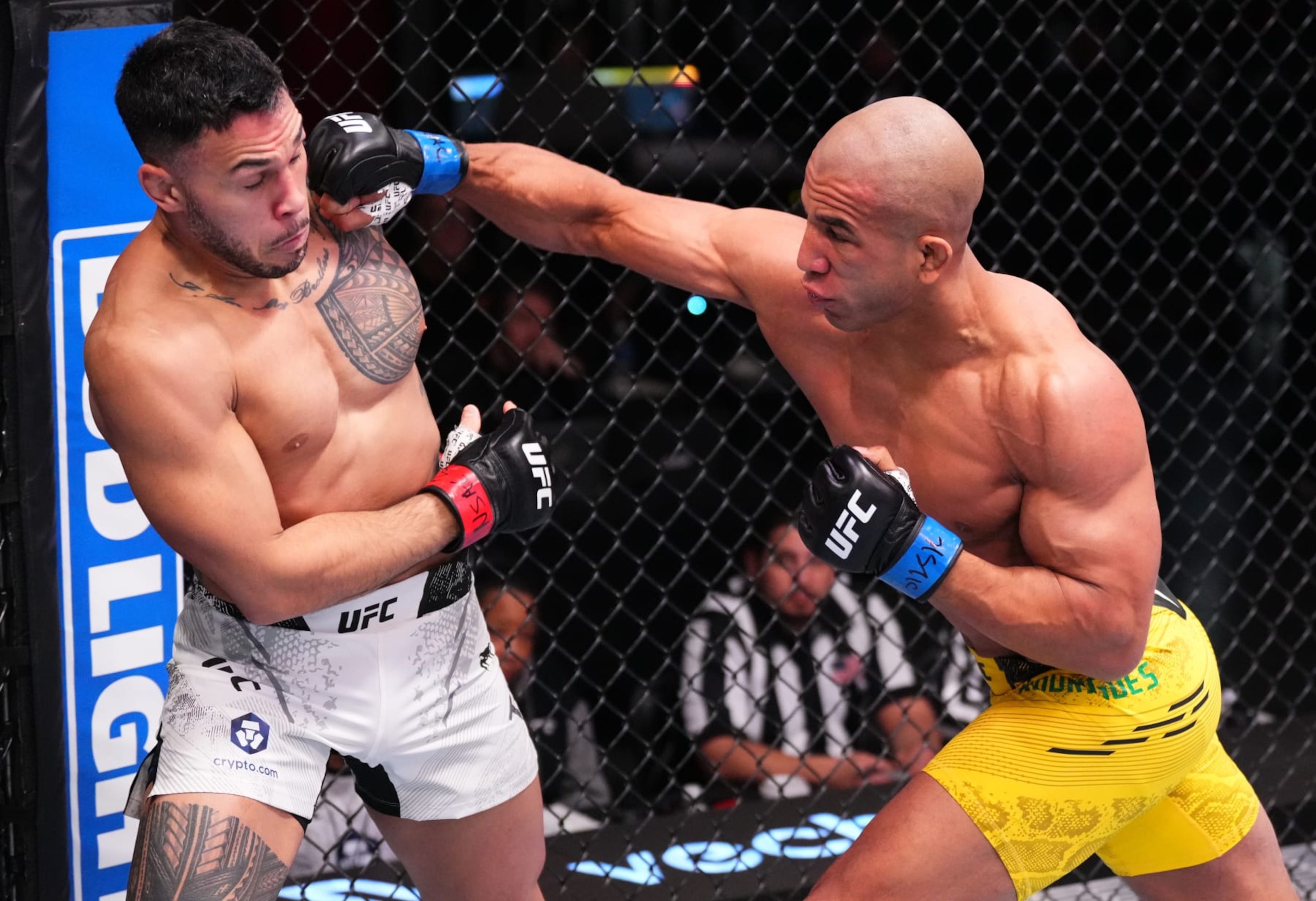 LAS VEGAS, NEVADA - FEBRUARY 10: (R-L) Gregory Rodrigues of Brazil punches Brad Tavares in a middleweight fight during the UFC Fight Night event at UFC APEX on February 10, 2024 in Las Vegas, Nevada. (Photo by Jeff Bottari/Zuffa LLC via Getty Images)