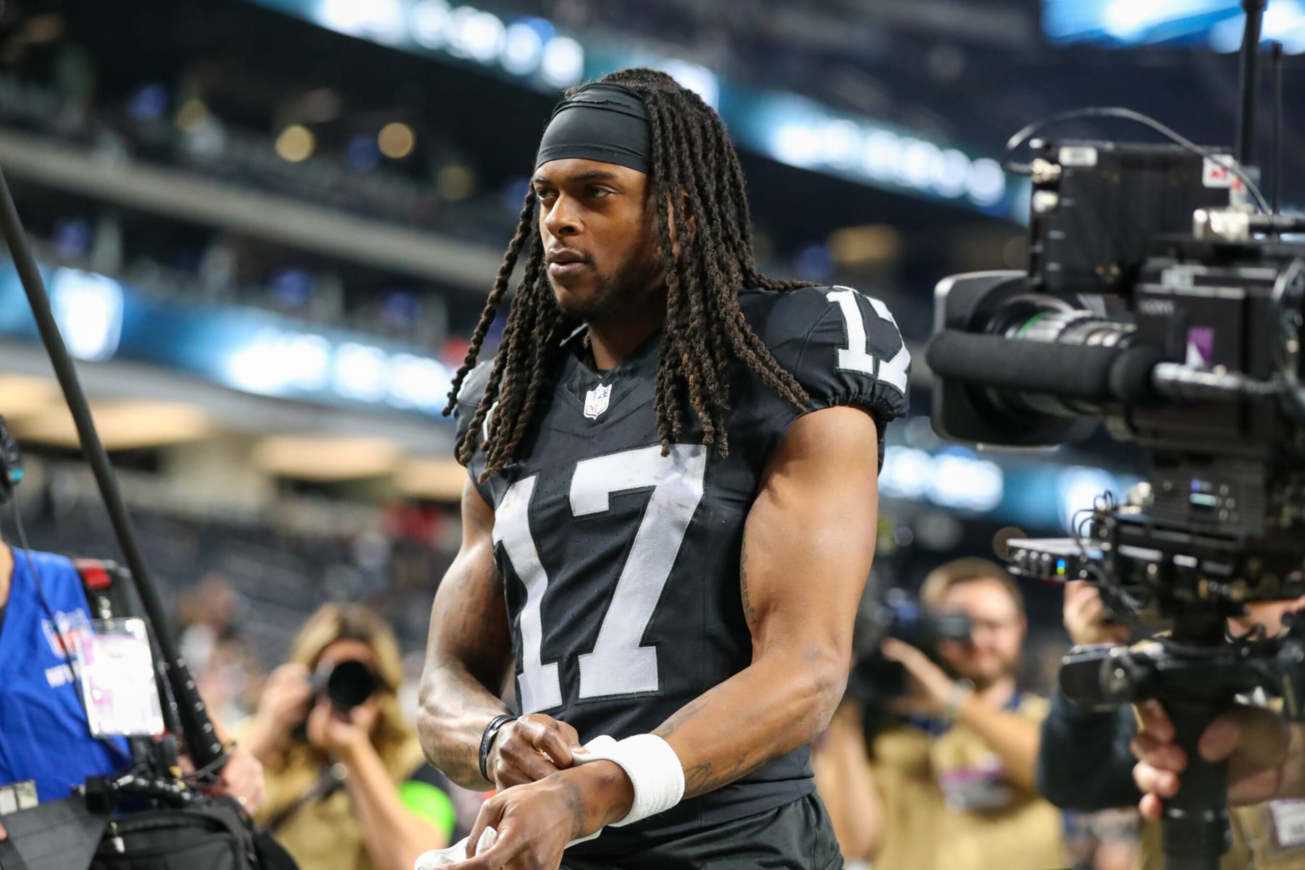 LAS VEGAS, NV - DECEMBER 14: Las Vegas Raiders wide receiver Davante Adams (17)  walks off of the field after the Los Angeles Chargers vs Las Vegas Raiders game on December 14, 2023, at Allegiant Stadium in Las Vegas, NV. (Photo by Jordon Kelly/Icon Sportswire via Getty Images)