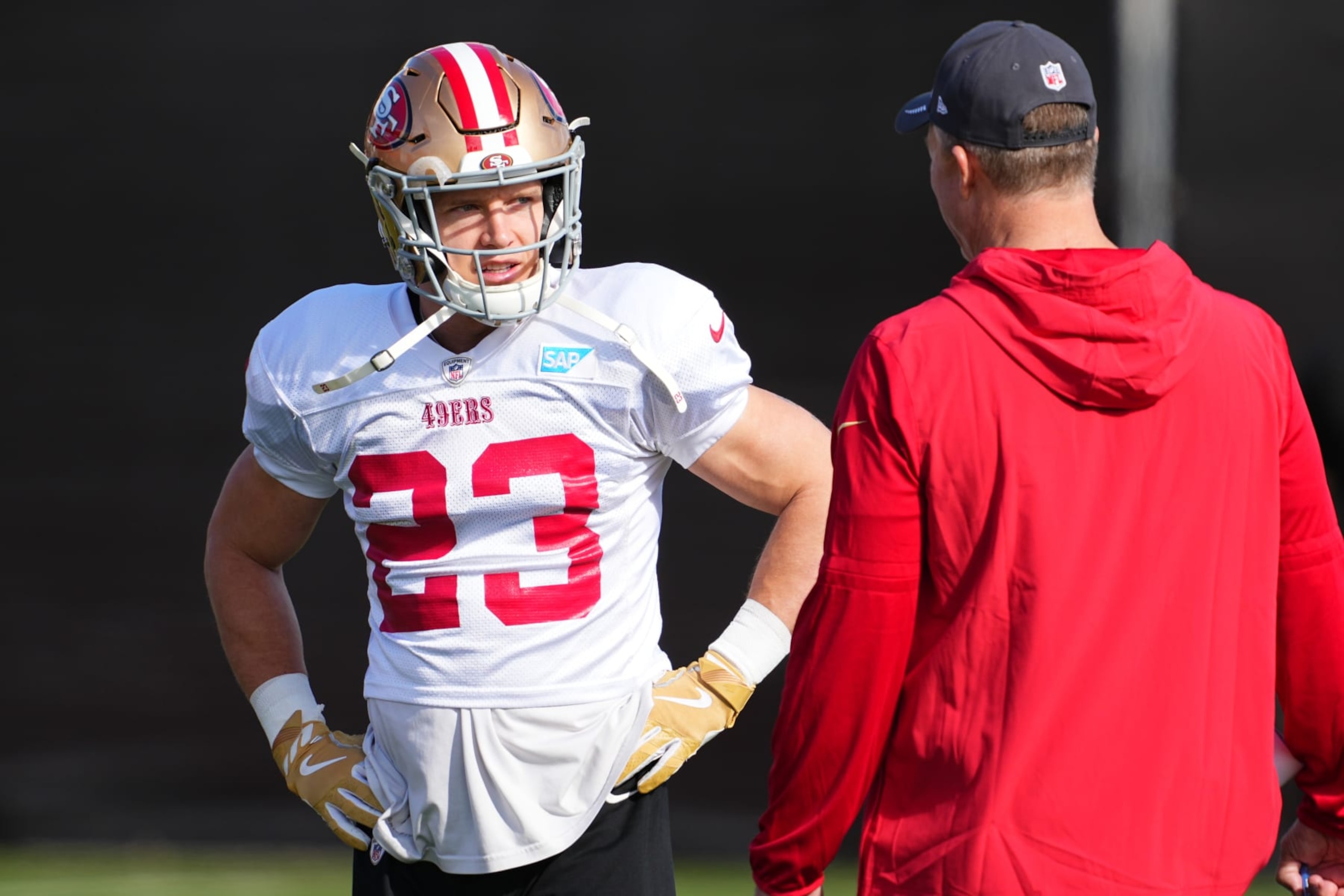 LAS VEGAS, NEVADA - FEBRUARY 08: (L-R) Christian McCaffrey #23 speaks to general manager John Lynch during San Francisco 49ers practice ahead of Super Bowl LVIII at Fertitta Football Complex on February 08, 2024 in Las Vegas, Nevada. (Photo by Chris Unger/Getty Images) LAS VEGAS, NEVADA - FEBRUARY 08: (L-R) Christian McCaffrey #23 speaks to general manager John Lynch during San Francisco 49ers practice ahead of Super Bowl LVIII at Fertitta Football Complex on February 08, 2024 in Las Vegas, Nevada. (Photo by Chris Unger/Getty Images)