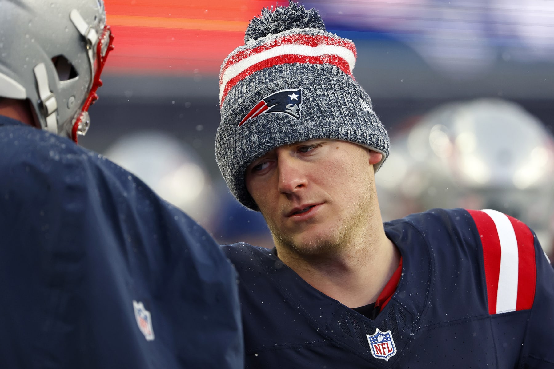 FOXBOROUGH, MASSACHUSETTS - JANUARY 07: Mac Jones #10 of the New England Patriots looks on after a game against the New York Jets at Gillette Stadium on January 07, 2024 in Foxborough, Massachusetts. (Photo by Winslow Townson/Getty Images)