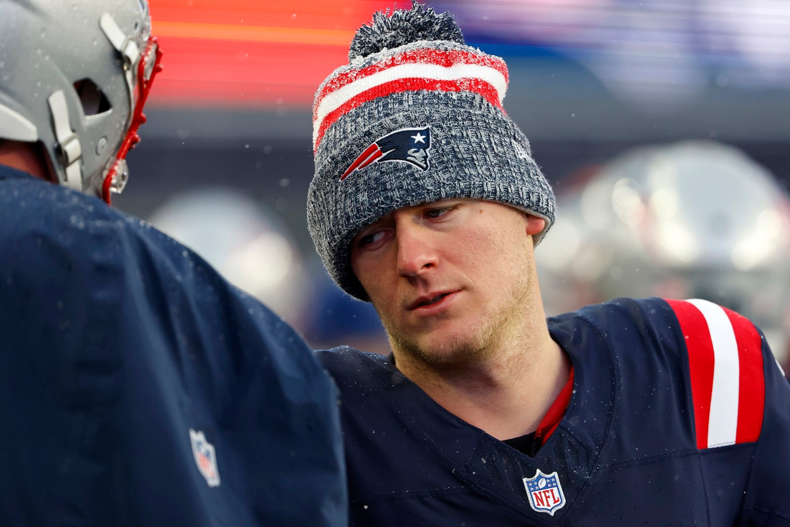 FOXBOROUGH, MASSACHUSETTS - JANUARY 07: Mac Jones #10 of the New England Patriots looks on after a game against the New York Jets at Gillette Stadium on January 07, 2024 in Foxborough, Massachusetts. (Photo by Winslow Townson/Getty Images)