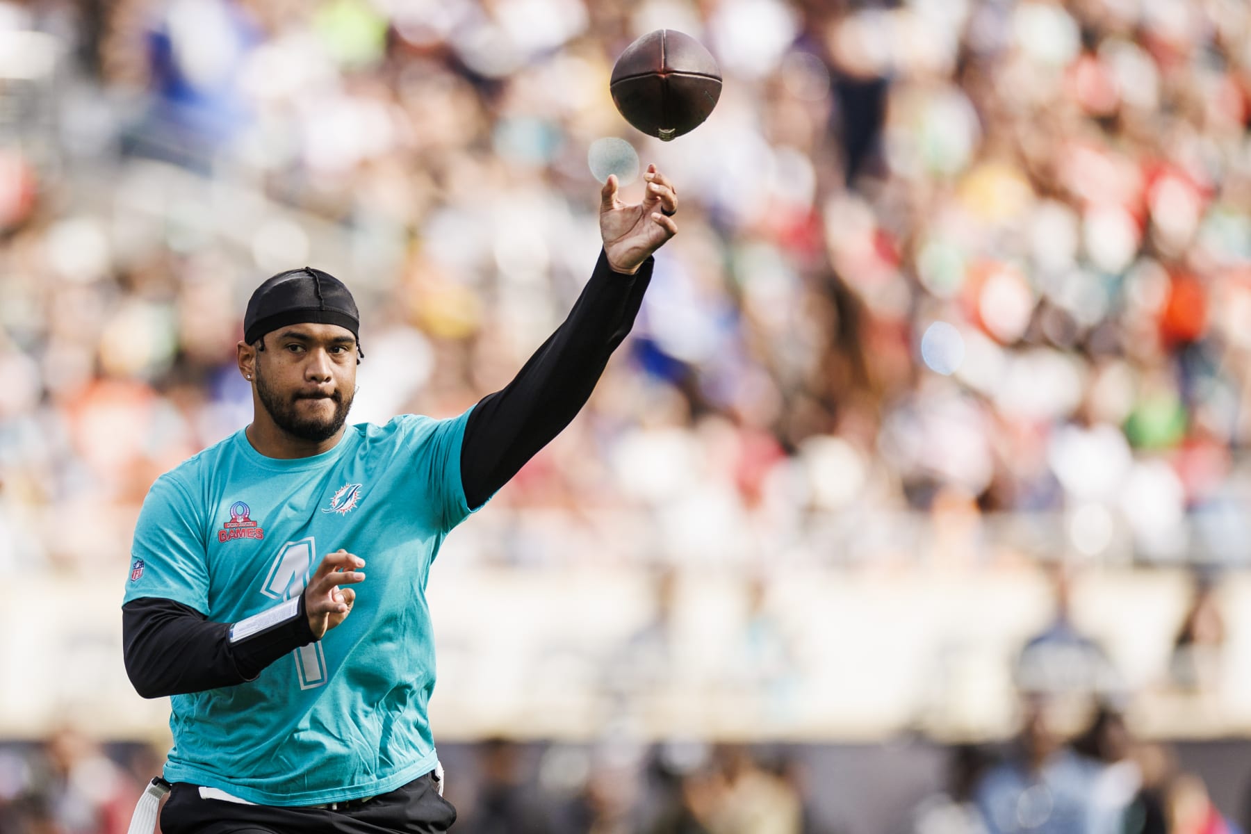 ORLANDO, FLORIDA - FEBRUARY 04: Tua Tagovailoa #1 of the Miami Dolphins and AFC throws a pass during the 2024 NFL Pro Bowl at Camping World Stadium on February 04, 2024 in Orlando, Florida. (Photo by James Gilbert/Getty Images)
