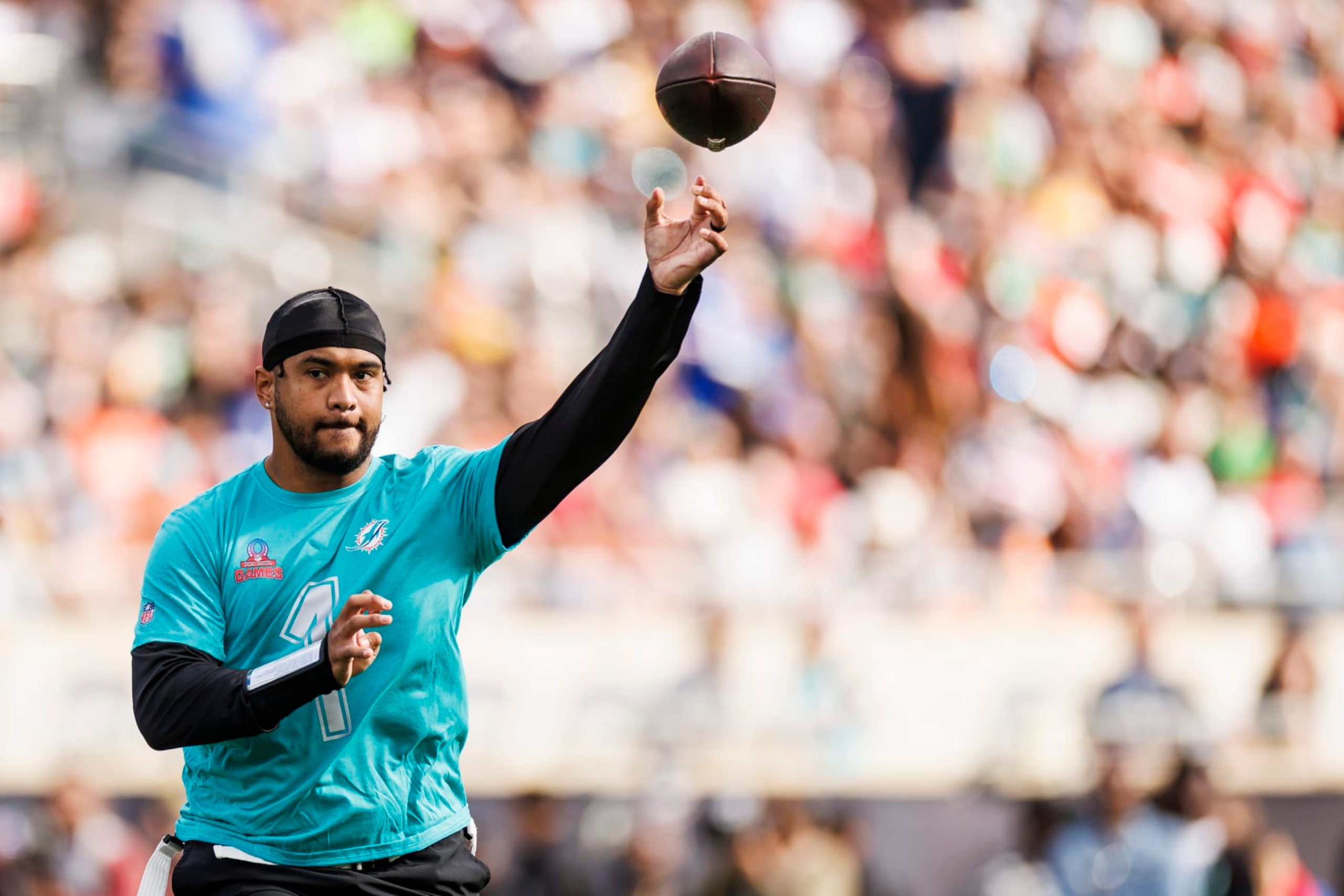 ORLANDO, FLORIDA - FEBRUARY 04: Tua Tagovailoa #1 of the Miami Dolphins and AFC throws a pass during the 2024 NFL Pro Bowl at Camping World Stadium on February 04, 2024 in Orlando, Florida. (Photo by James Gilbert/Getty Images)