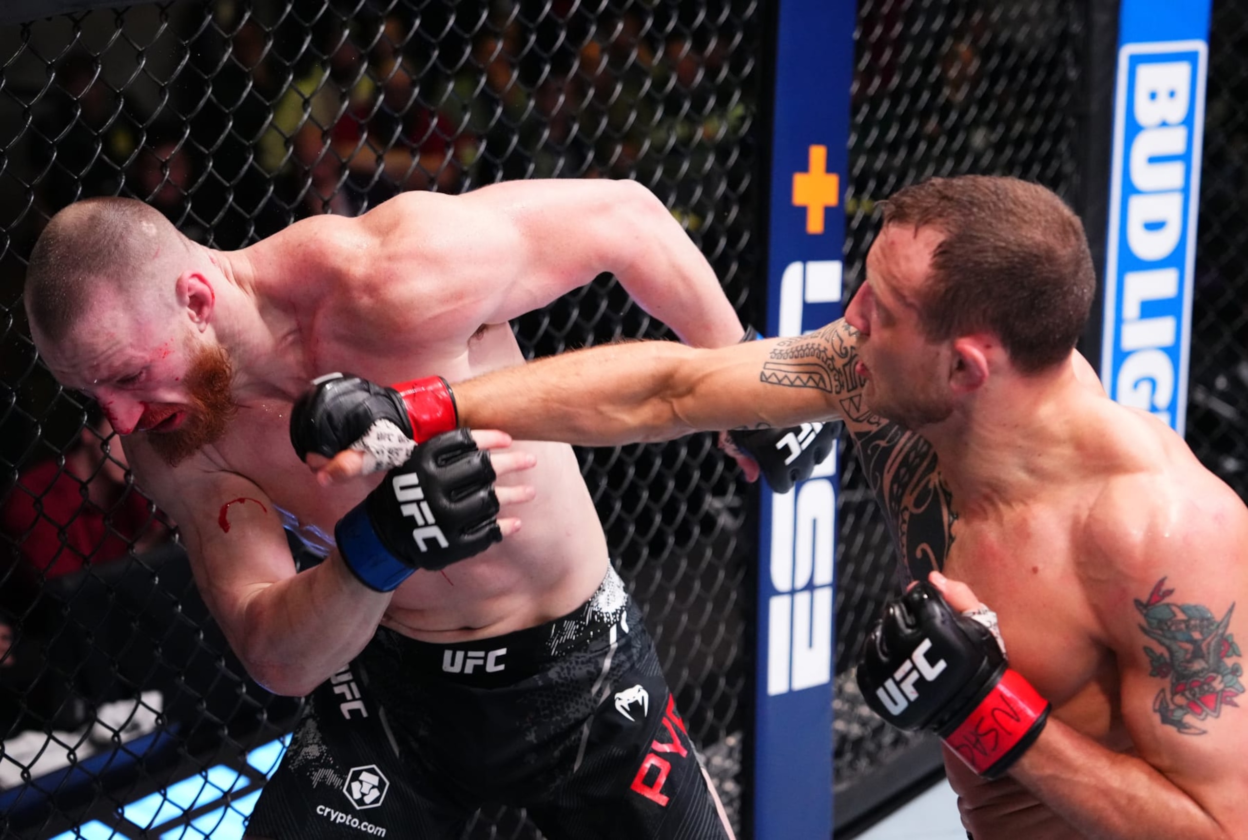 Jack Hermansson punches Joe Pyfer.