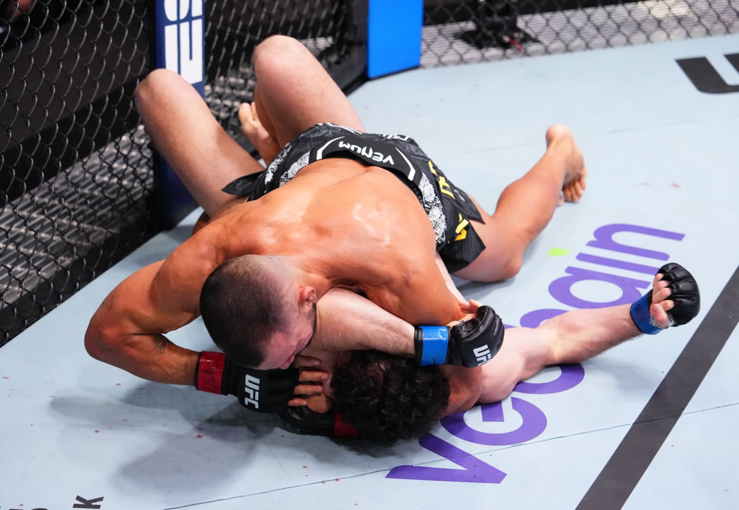 Rodolfo Vieira secures a submission against Armen Petrosyan.