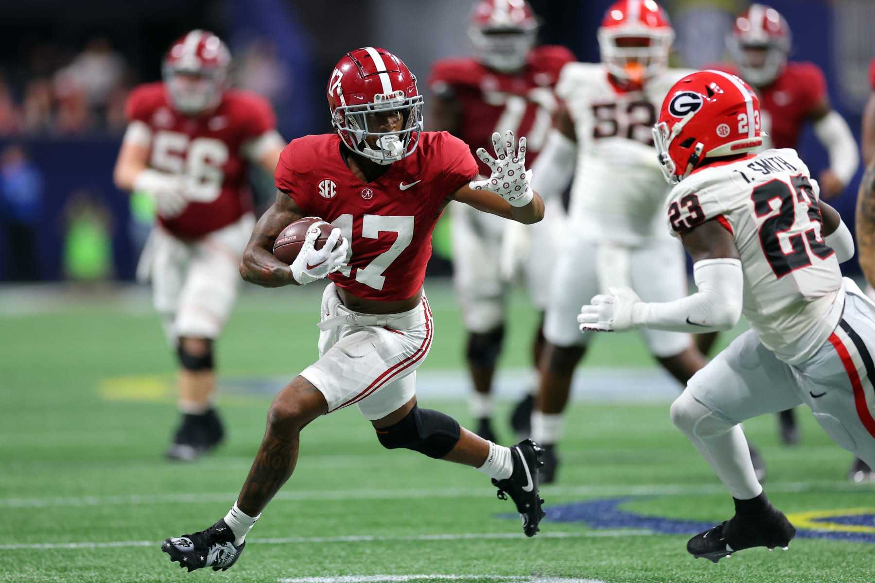 ATLANTA, GEORGIA - DECEMBER 02: Isaiah Bond #17 of the Alabama Crimson Tide makes a catch against Tykee Smith #23 of the Georgia Bulldogs during the fourth quarter in the SEC Championship at Mercedes-Benz Stadium on December 02, 2023 in Atlanta, Georgia. (Photo by Kevin C. Cox/Getty Images)