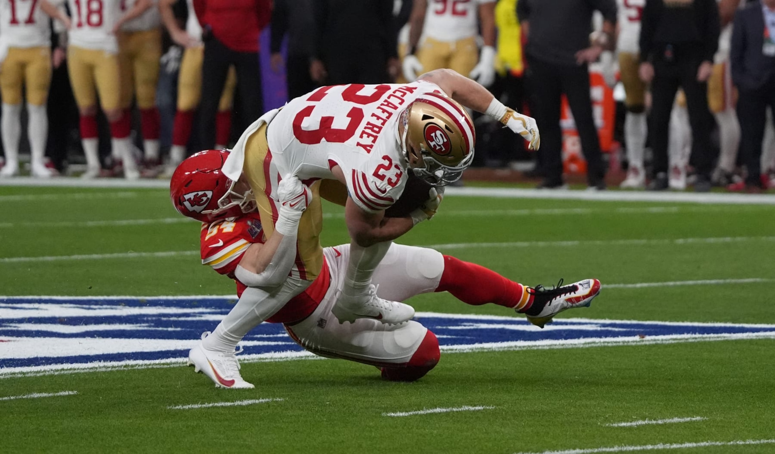 Kansas City Chiefs' linebacker #54 Leo Chenal stops San Francisco 49ers' running back #23 Christian McCaffrey during Super Bowl LVIII between the Kansas City Chiefs and the San Francisco 49ers at Allegiant Stadium in Las Vegas, Nevada, February 11, 2024. (Photo by TIMOTHY A. CLARY / AFP) (Photo by TIMOTHY A. CLARY/AFP via Getty Images)
