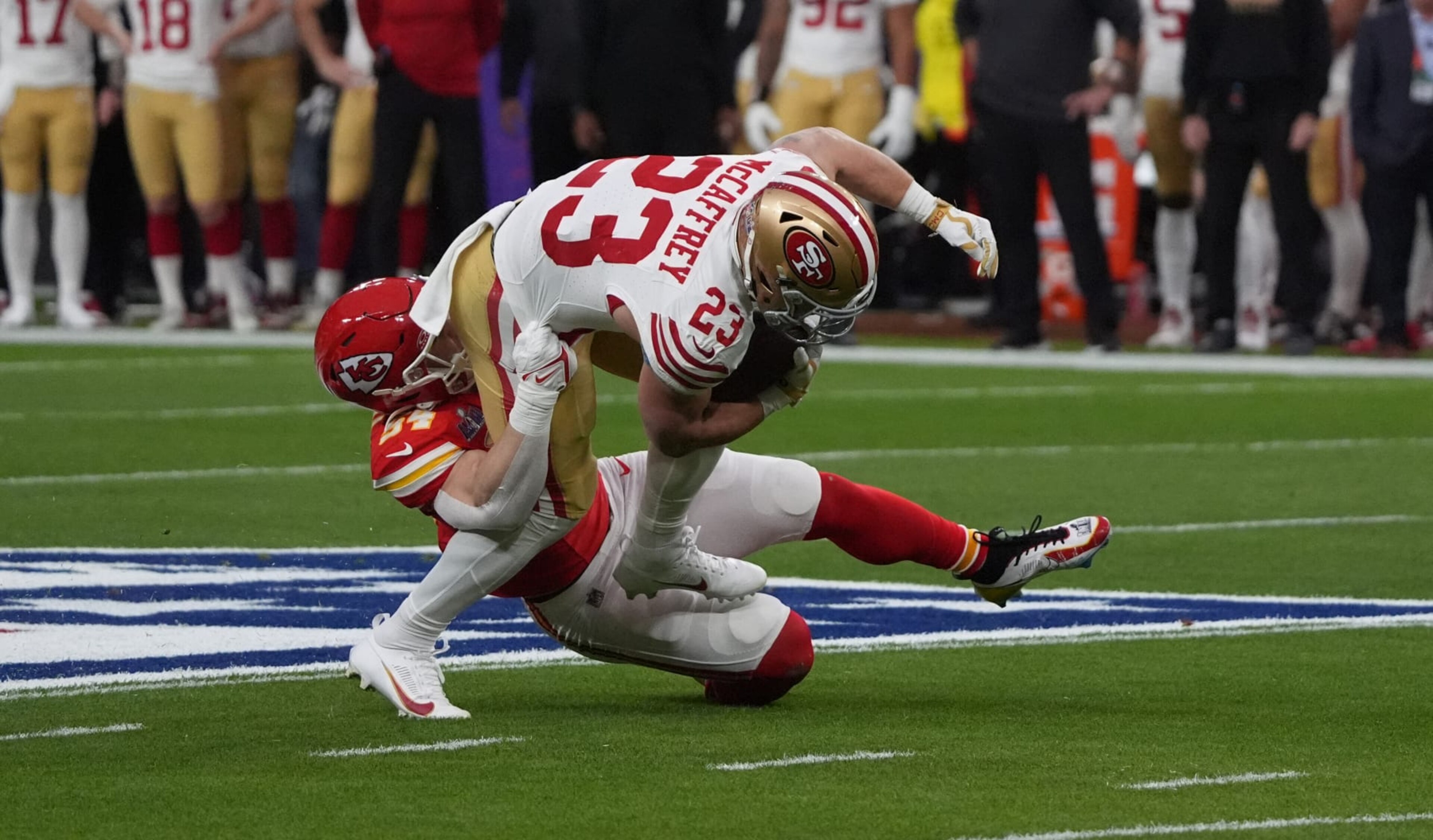 Kansas City Chiefs' linebacker #54 Leo Chenal stops San Francisco 49ers' running back #23 Christian McCaffrey during Super Bowl LVIII between the Kansas City Chiefs and the San Francisco 49ers at Allegiant Stadium in Las Vegas, Nevada, February 11, 2024. (Photo by TIMOTHY A. CLARY / AFP) (Photo by TIMOTHY A. CLARY/AFP via Getty Images)