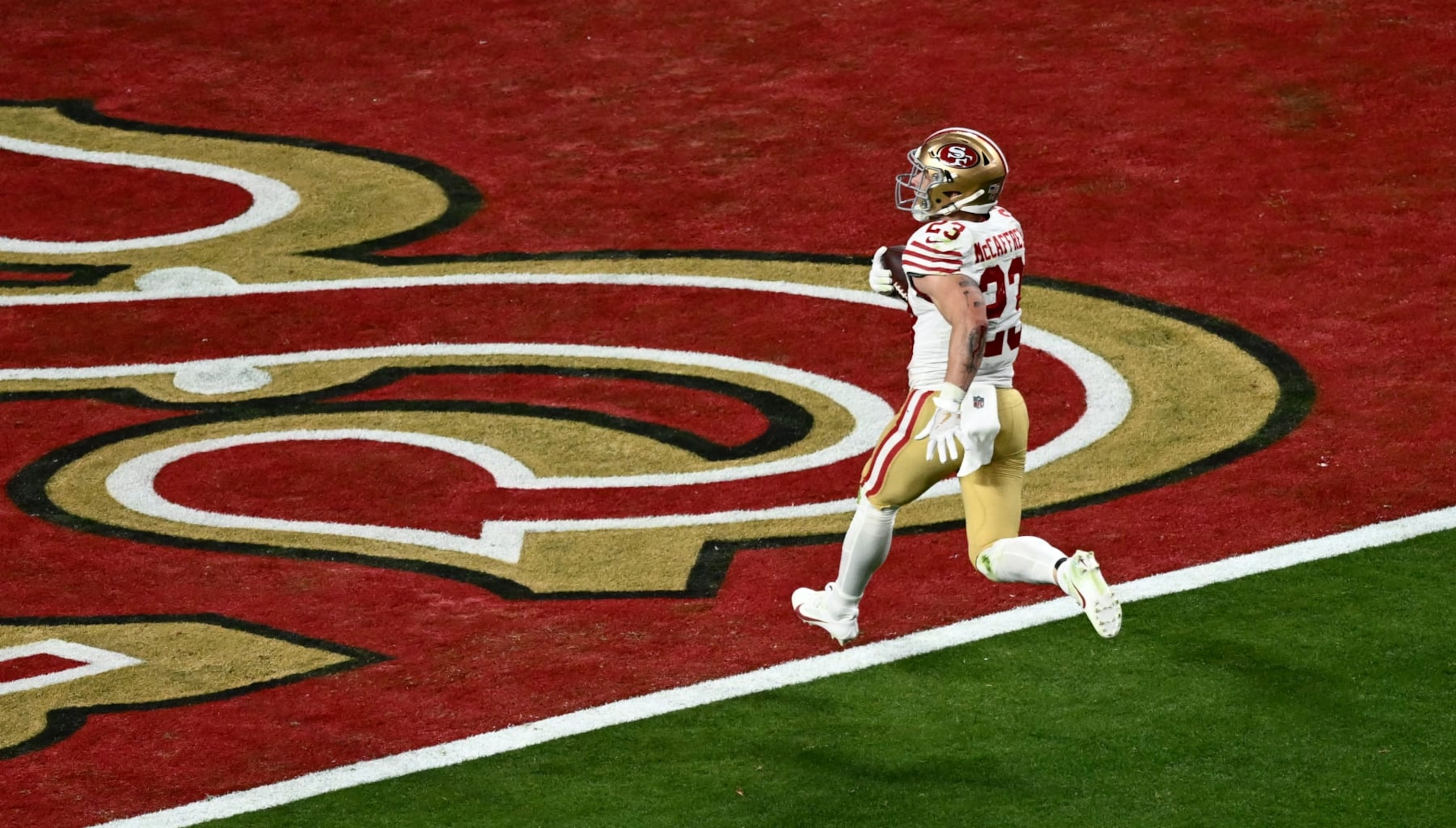 San Francisco 49ers' running back #23 Christian McCaffrey scores a touchdown during Super Bowl LVIII between the Kansas City Chiefs and the San Francisco 49ers at Allegiant Stadium in Las Vegas, Nevada, February 11, 2024. (Photo by Patrick T. Fallon / AFP) (Photo by PATRICK T. FALLON/AFP via Getty Images)