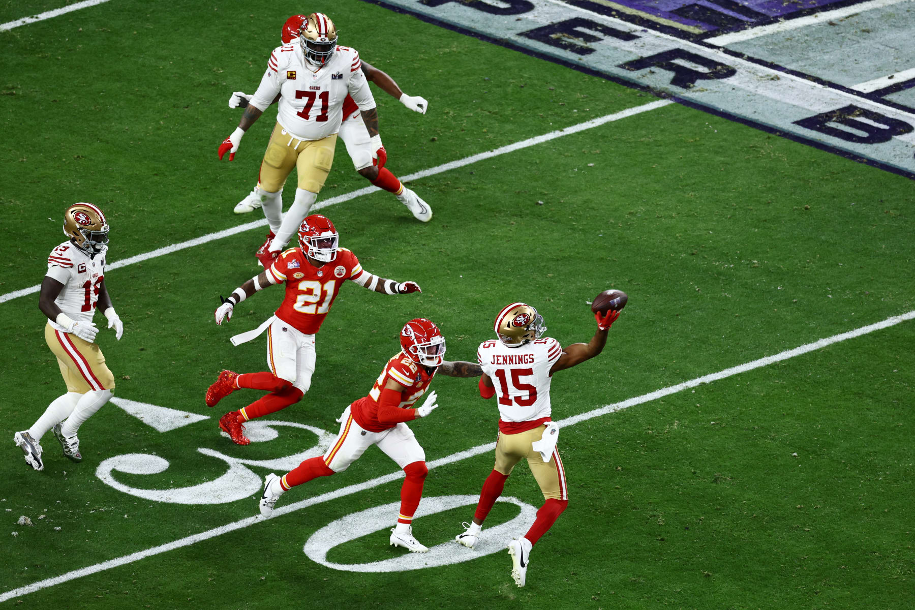 LAS VEGAS, NEVADA - FEBRUARY 11: Jauan Jennings #15 of the San Francisco 49ers throws the ball to Christian McCaffrey #23  for a touchdown in the second quarter against the Kansas City Chiefs during Super Bowl LVIII at Allegiant Stadium on February 11, 2024 in Las Vegas, Nevada. (Photo by Tim Nwachukwu/Getty Images)