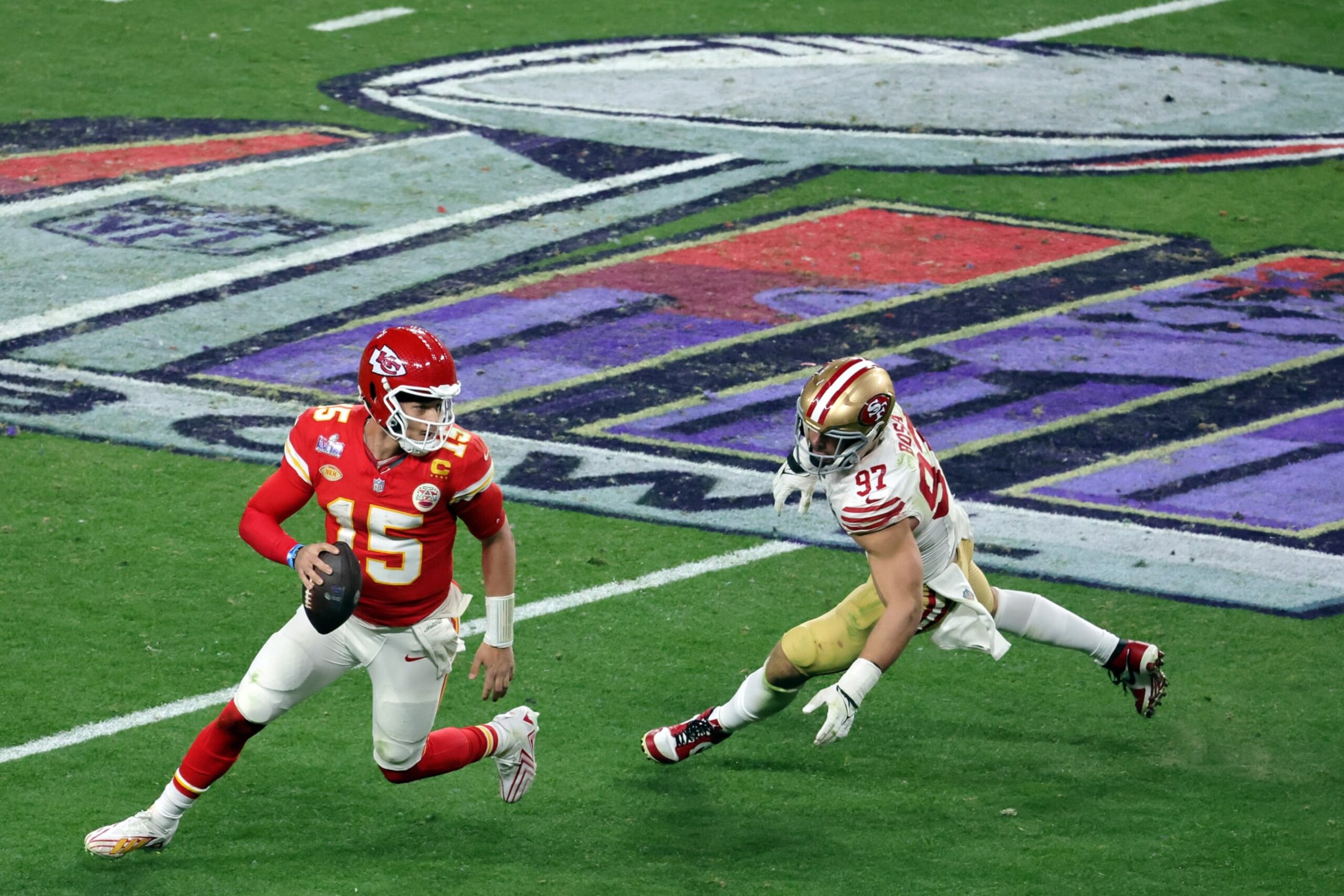 LAS VEGAS, NEVADA - FEBRUARY 11: Patrick Mahomes #15 of the Kansas City Chiefs looks to pass in the fourth quarter against Nick Bosa #97 of the San Francisco 49ers during Super Bowl LVIII at Allegiant Stadium on February 11, 2024 in Las Vegas, Nevada. (Photo by Ethan Miller/Getty Images)