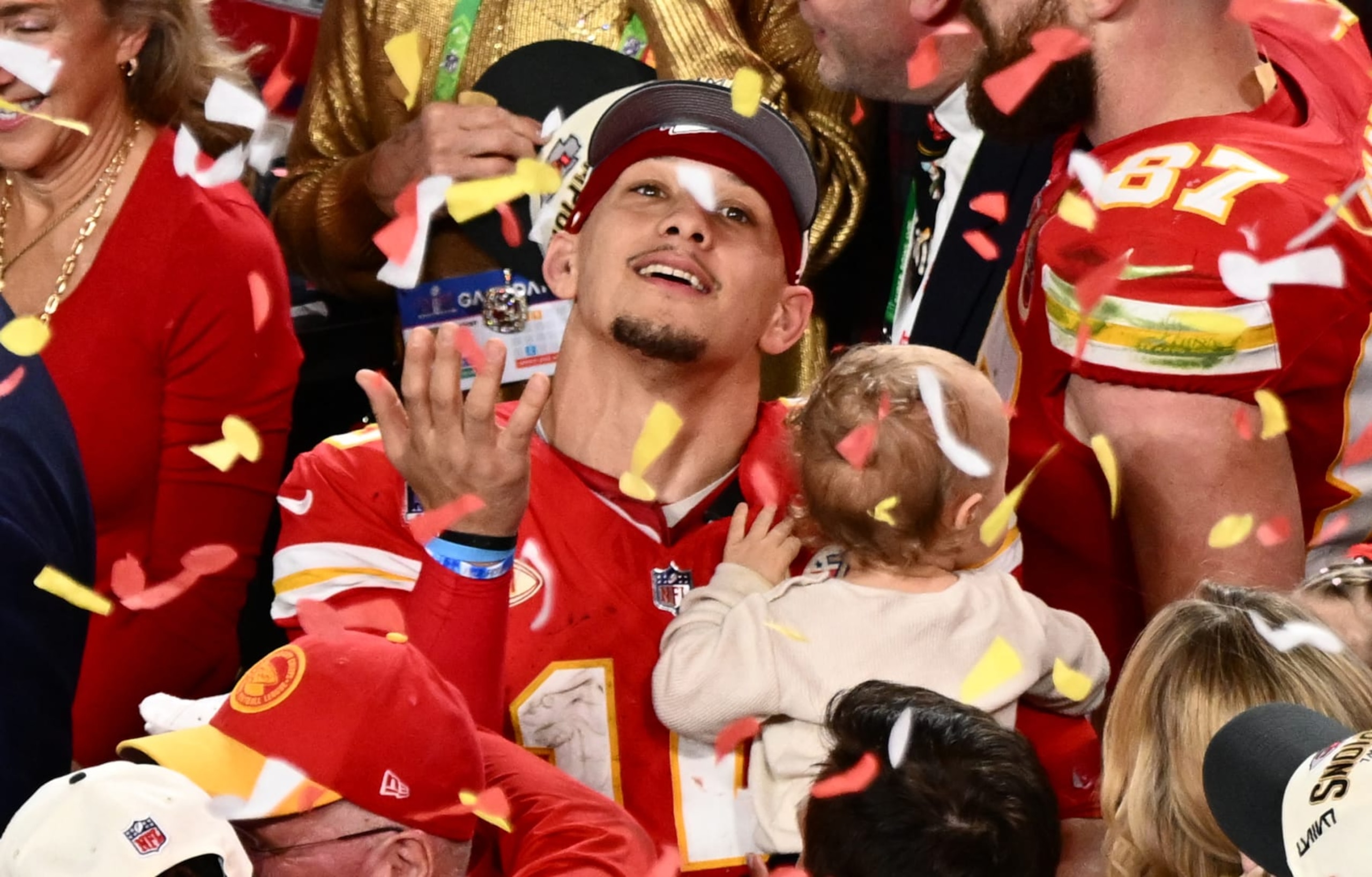 Kansas City Chiefs' quarterback #15 Patrick Mahomes with his son Patrick Bronze watches confettis as they celebrate winning Super Bowl LVIII against the San Francisco 49ers at Allegiant Stadium in Las Vegas, Nevada, February 11, 2024. (Photo by Patrick T. Fallon / AFP) (Photo by PATRICK T. FALLON/AFP via Getty Images)