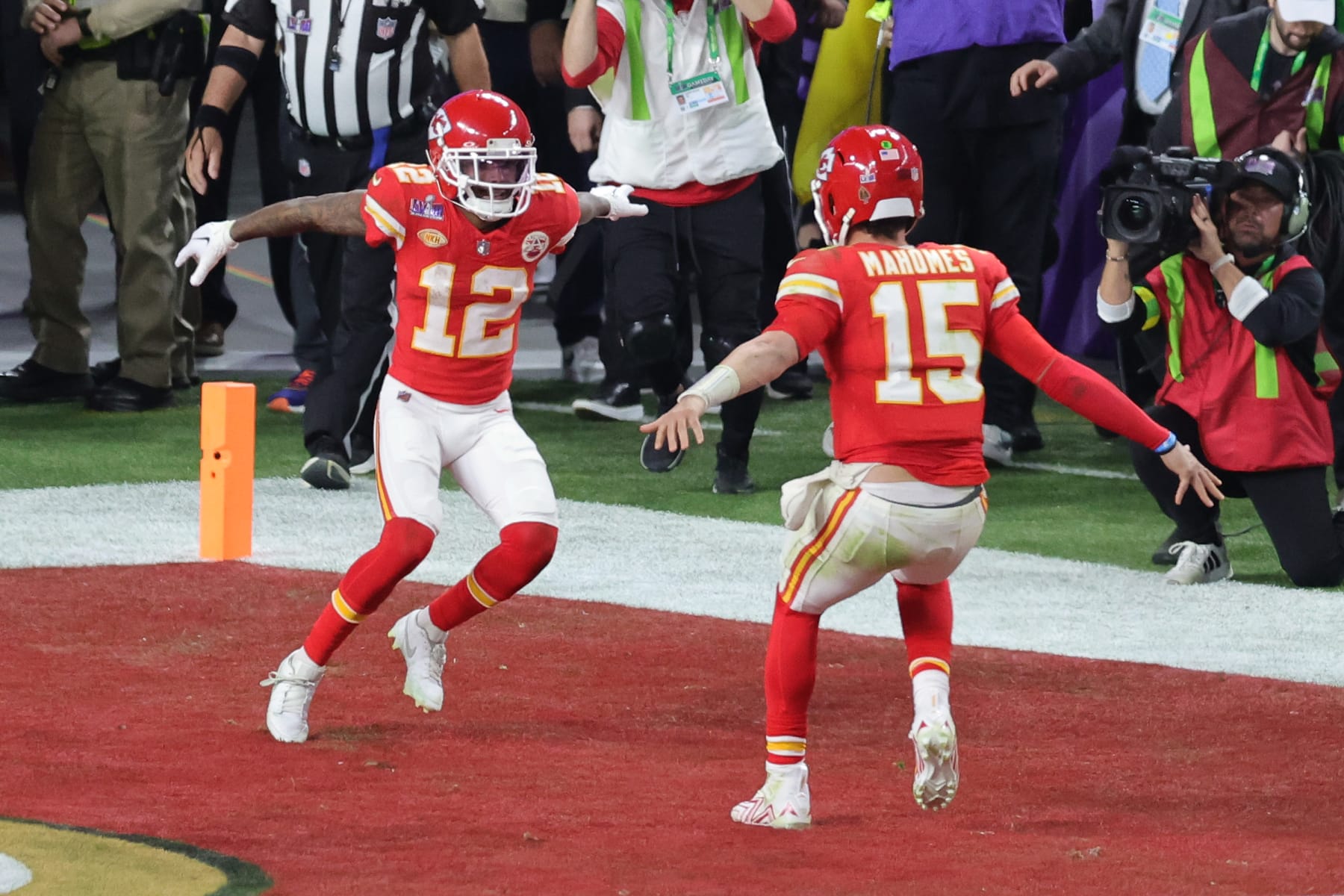 LAS VEGAS, NEVADA - FEBRUARY 11: Mecole Hardman Jr. #12 of the Kansas City Chiefs celebrates with Patrick Mahomes #15 after scoring the game-winning touchdown in overtime to defeat the San Francisco 49ers 25-22 during Super Bowl LVIII at Allegiant Stadium on February 11, 2024 in Las Vegas, Nevada. (Photo by Ethan Miller/Getty Images)